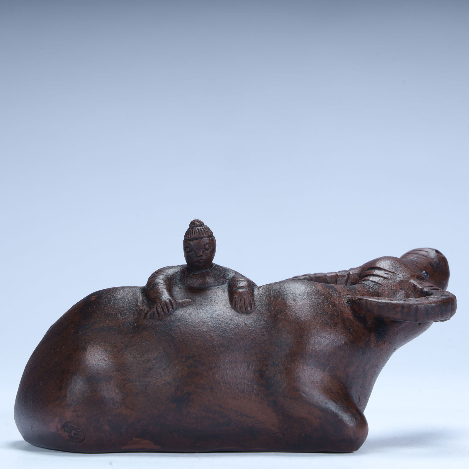 A Qing Dynasty purple sand shepherd riding a cow ornament: Qing Dynasty purple sand shepherd riding cow ornament SIZE: H:6cm L:12cm W:7cm W:144g