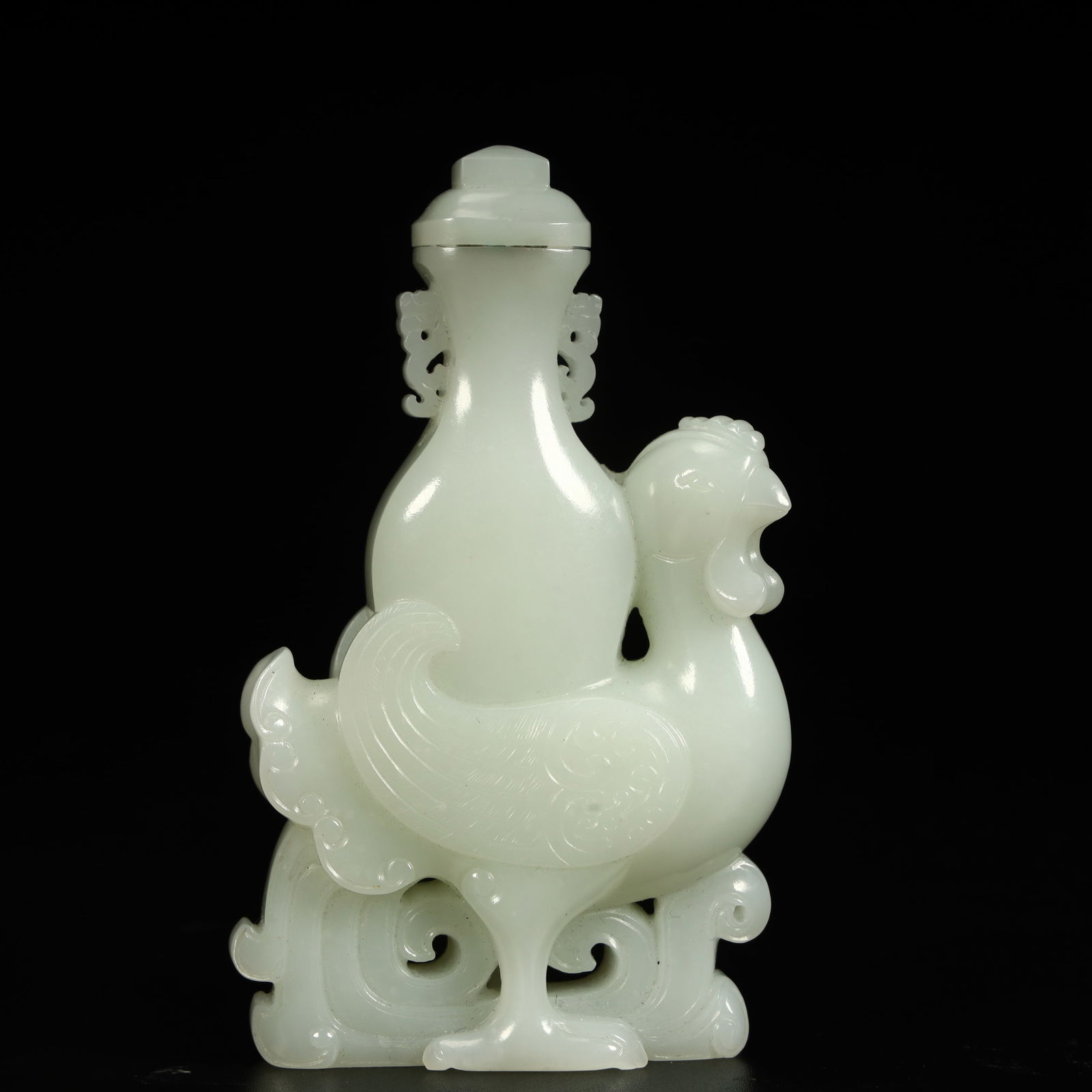 A Qing Dynasty Hetian white jade chicken-shaped bottle (1 of 9)