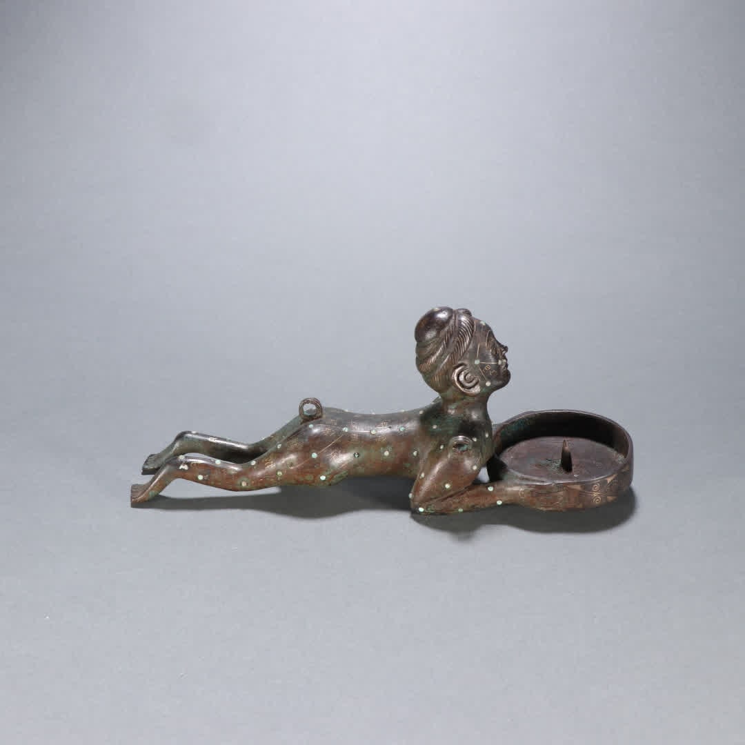 A Han Dynasty copper cuo gold and silver figure candlestick: Han Dynasty copper candlestick SIZE: H:8cm W:20cm W:500g