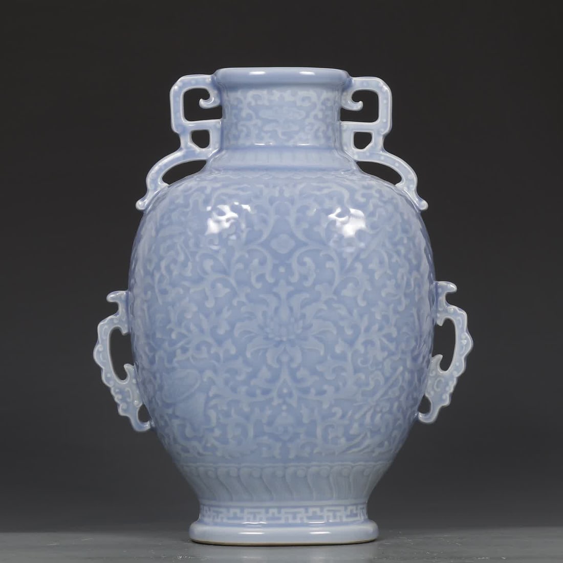 A Qing Qianlong sky blue glaze eight treasure entwined lotus pattern flat bottle: Qing Qianlong sky blue glaze eight treasures entwined lotus pattern flat bottle SIZE: H:29cm mouthD:8cm D:23cm