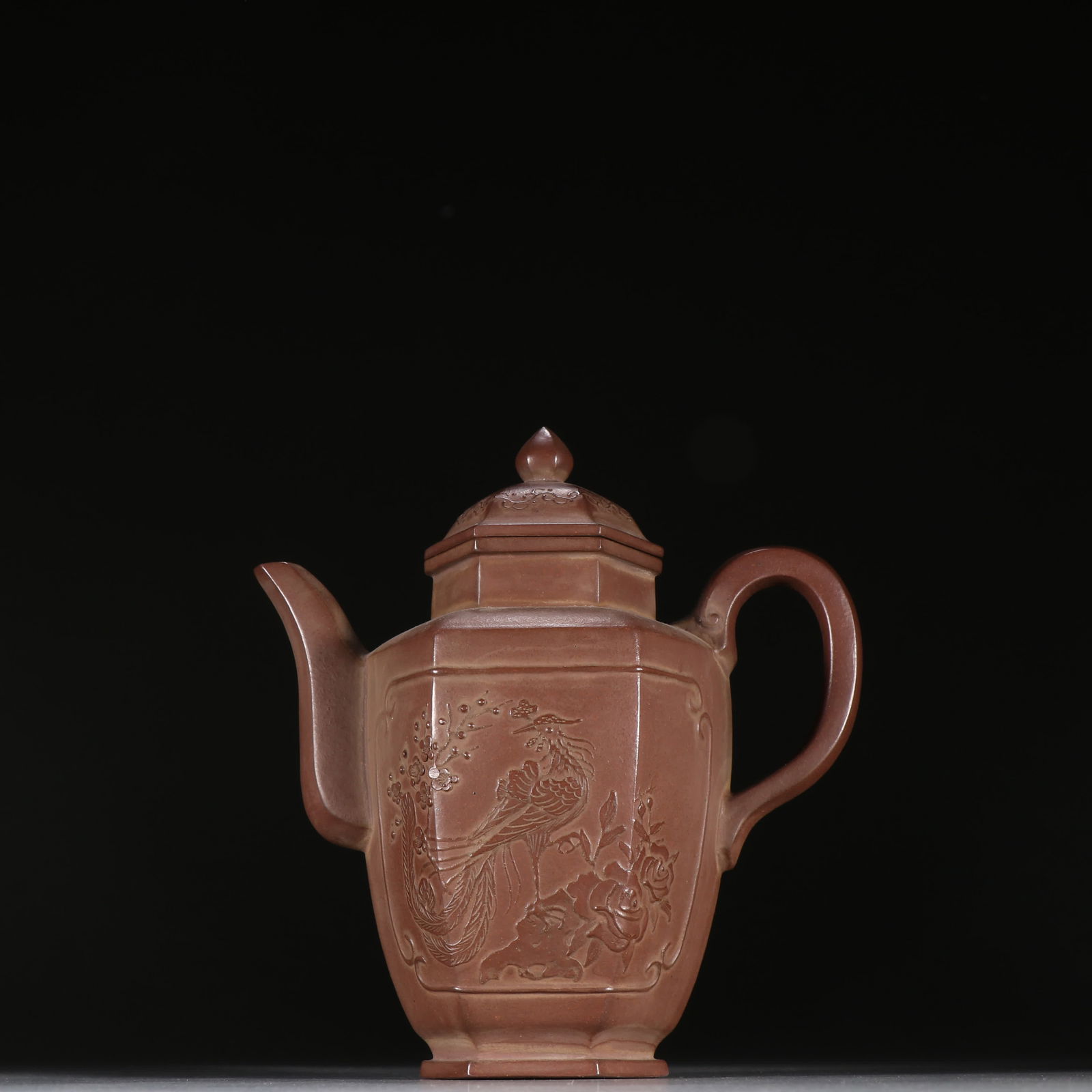 A Qing Dynasty purple sand flower and bird pattern teapot: Qing Dynasty purple sand flower and bird pattern teapot SIZE: H:15.5cm W:14.3cm