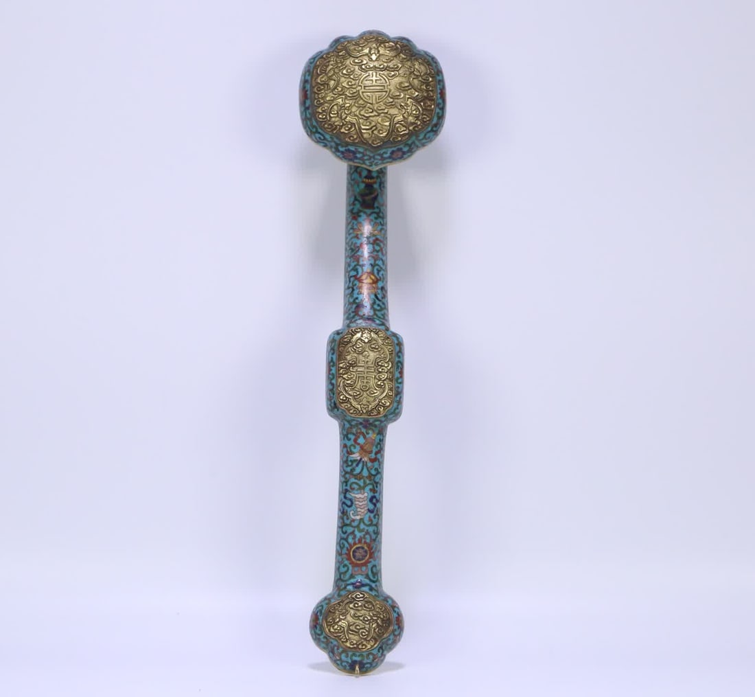 A Qing Dynasty cloisonné five-blessing longevity eight-treasure pattern ruyi ornament: Qing Dynasty cloisonné five blessings to celebrate longevity and eight treasure pattern ruyi ornaments SIZE: 44x10.5x9cm W:988g