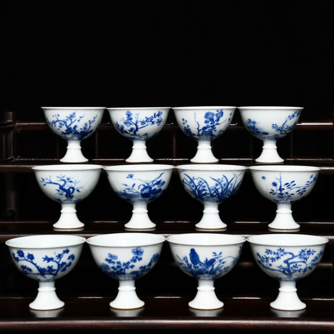 A set of Qing Kangxi blue and white twelve flower god goblets: Qing Kangxi blue and white twelve flower god goblets SIZE: H:6.3cm D:7.5cm (The Dimensions Of All Batches Are Manually Measured.If You Need More Detailed Information, Please Contact Our Customer Servi