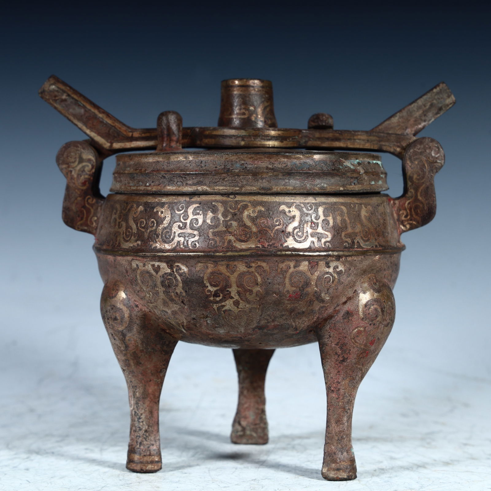 A Qing Dynasty copper and silver three-legged tripod (1 of 9)