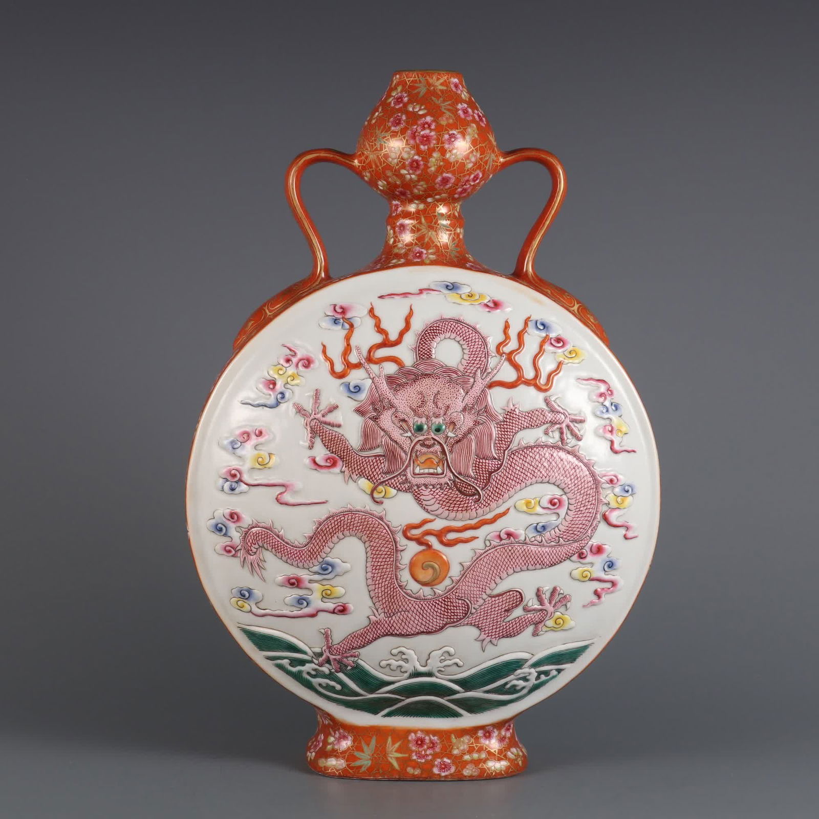 A coral red background with gold window carving and colorful tyrannical flat vase made in the (1 of 9)