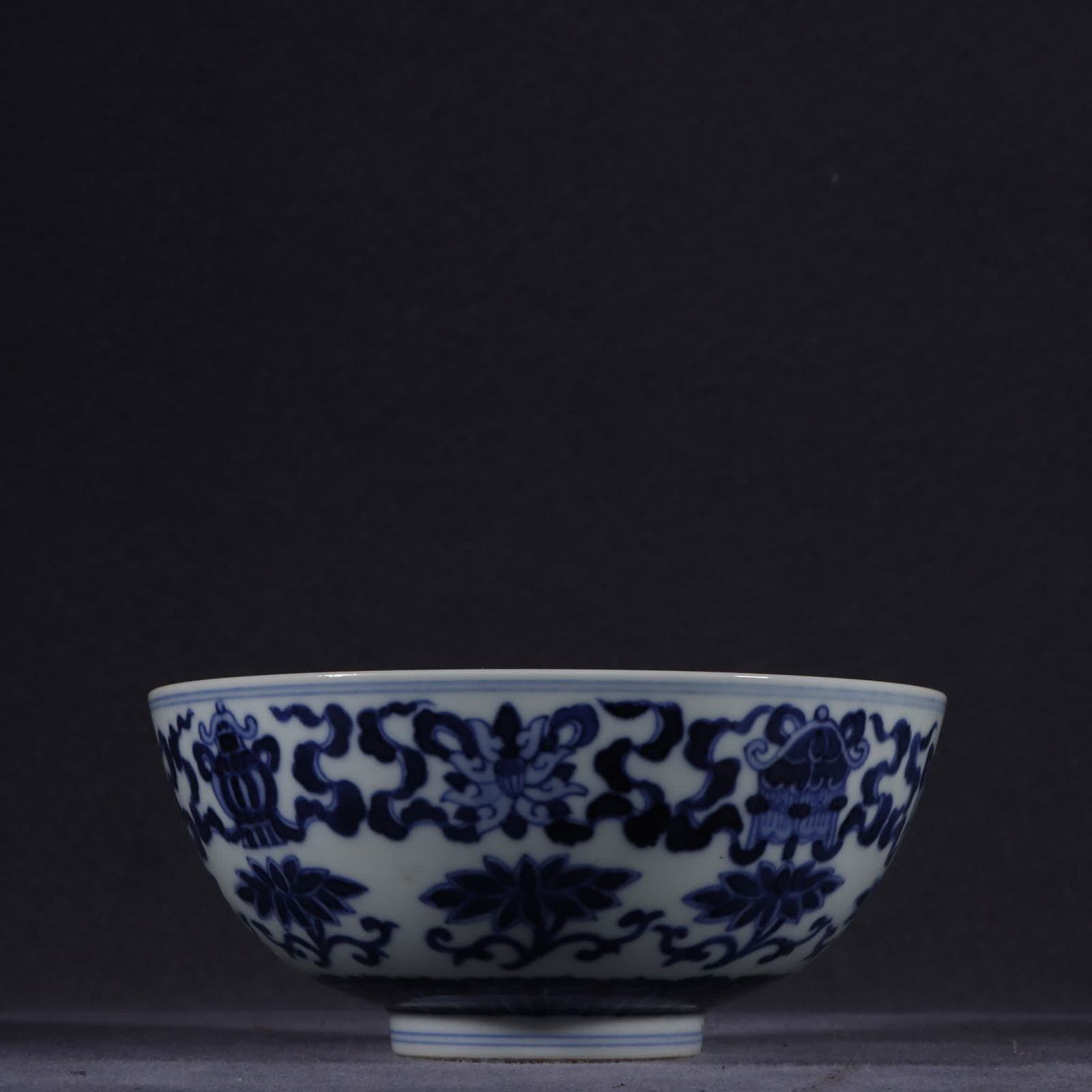 A Qing Dynasty Guangxu blue and white eight-treasure pattern bowl: Qing Dynasty Guangxu blue and white eight treasure pattern bowl SIZE: H:6.2cm W:14cm (The Dimensions Of All Batches Are Manually Measured.If You Need More Detailed Information, Please Contact Our