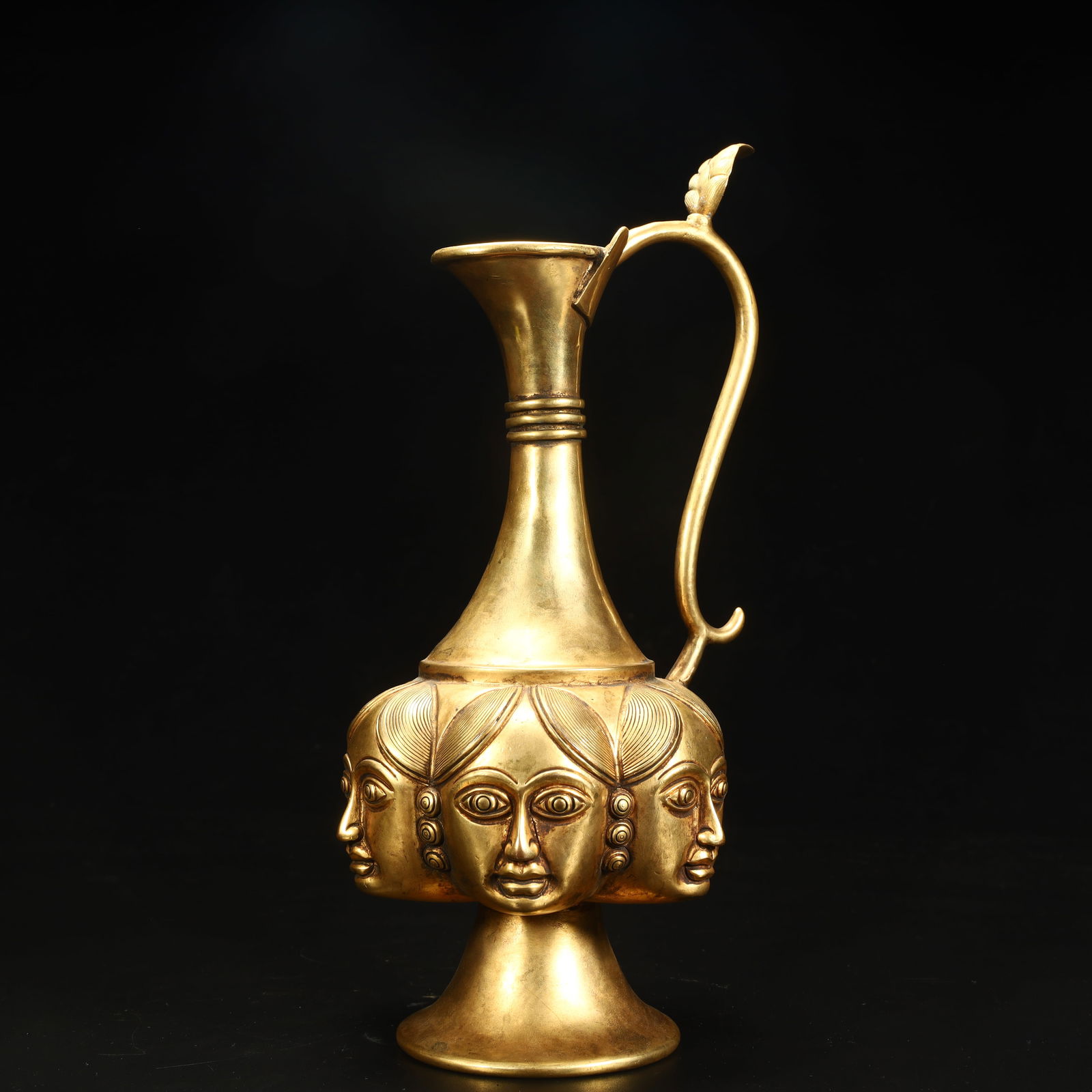 A copper-gilt multifaceted figure holding a pot: A bronze gilt multifaceted figure holding a pot SIZE: H:23.8cm L:12cm W:10cm W:723g (The Dimensions Of All Batches Are Manually Measured.If You Need More Detailed Information, Please Contact Our