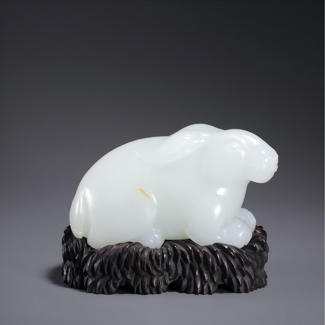 A Qing Dynasty Hetian jade reclining rabbit ornament (1 of 10)
