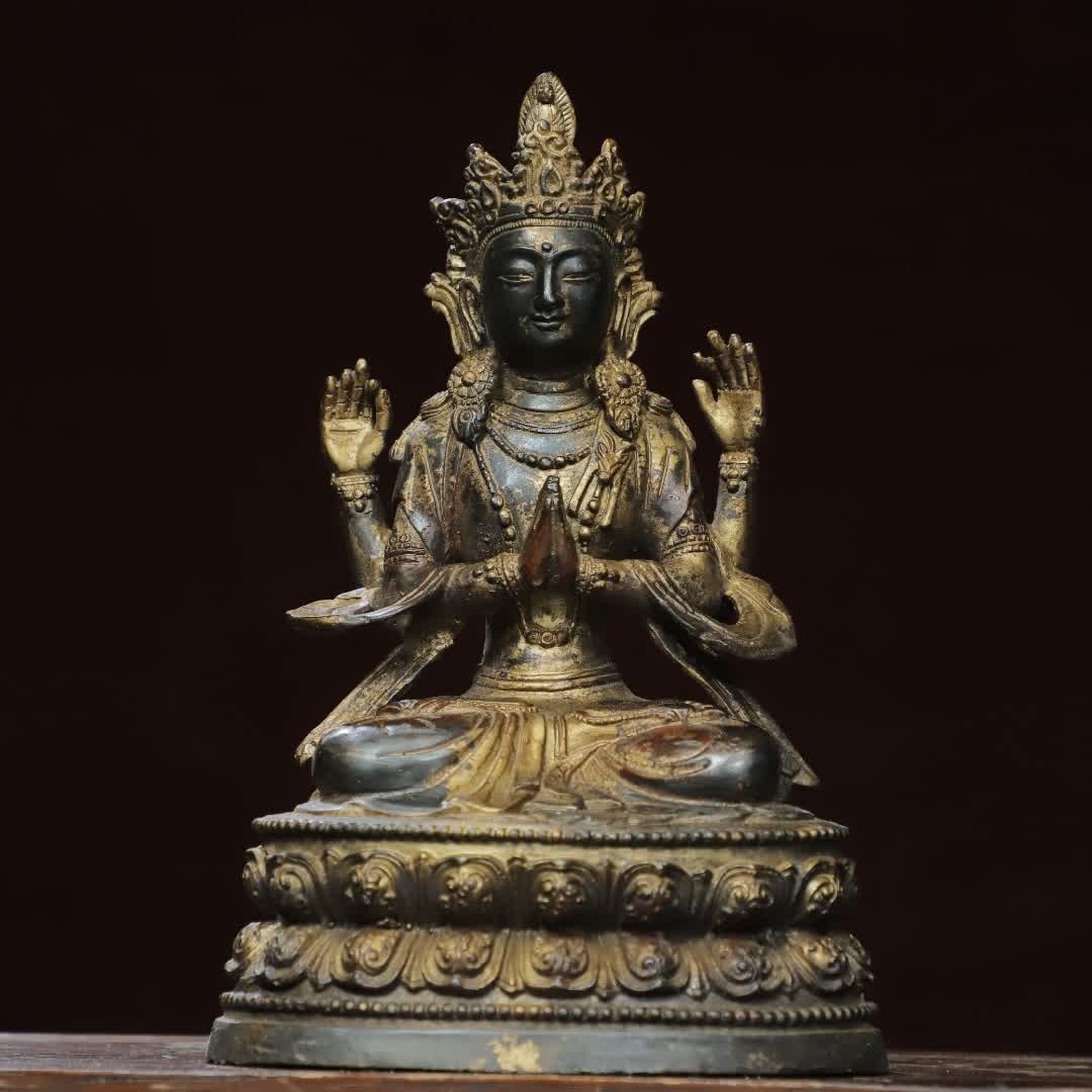 A bronze gold four-armed Guanyin Buddha statue (1 of 9)