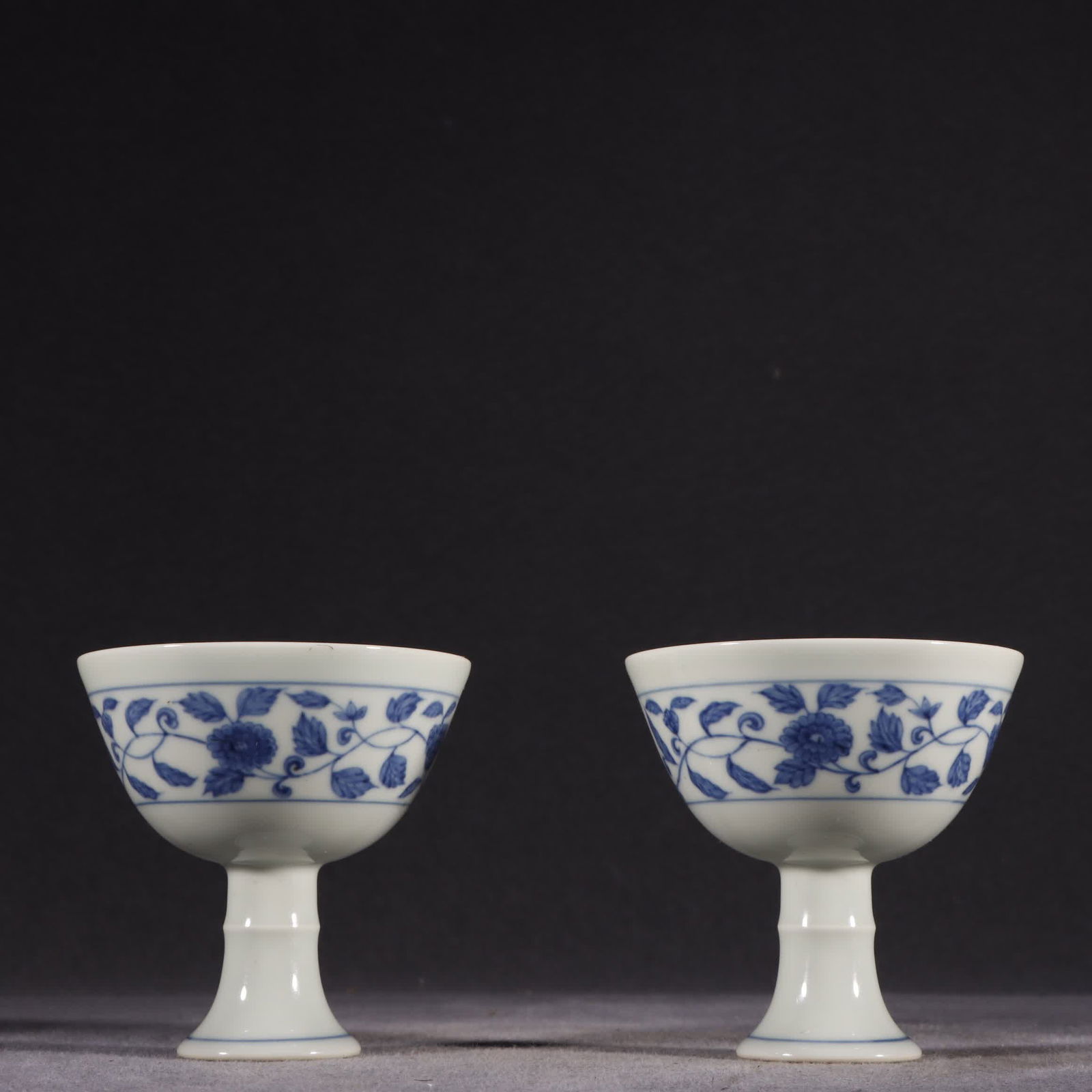 A pair of Ming Dynasty Chenghua blue and white entwined flower pattern goblets (1 of 9)