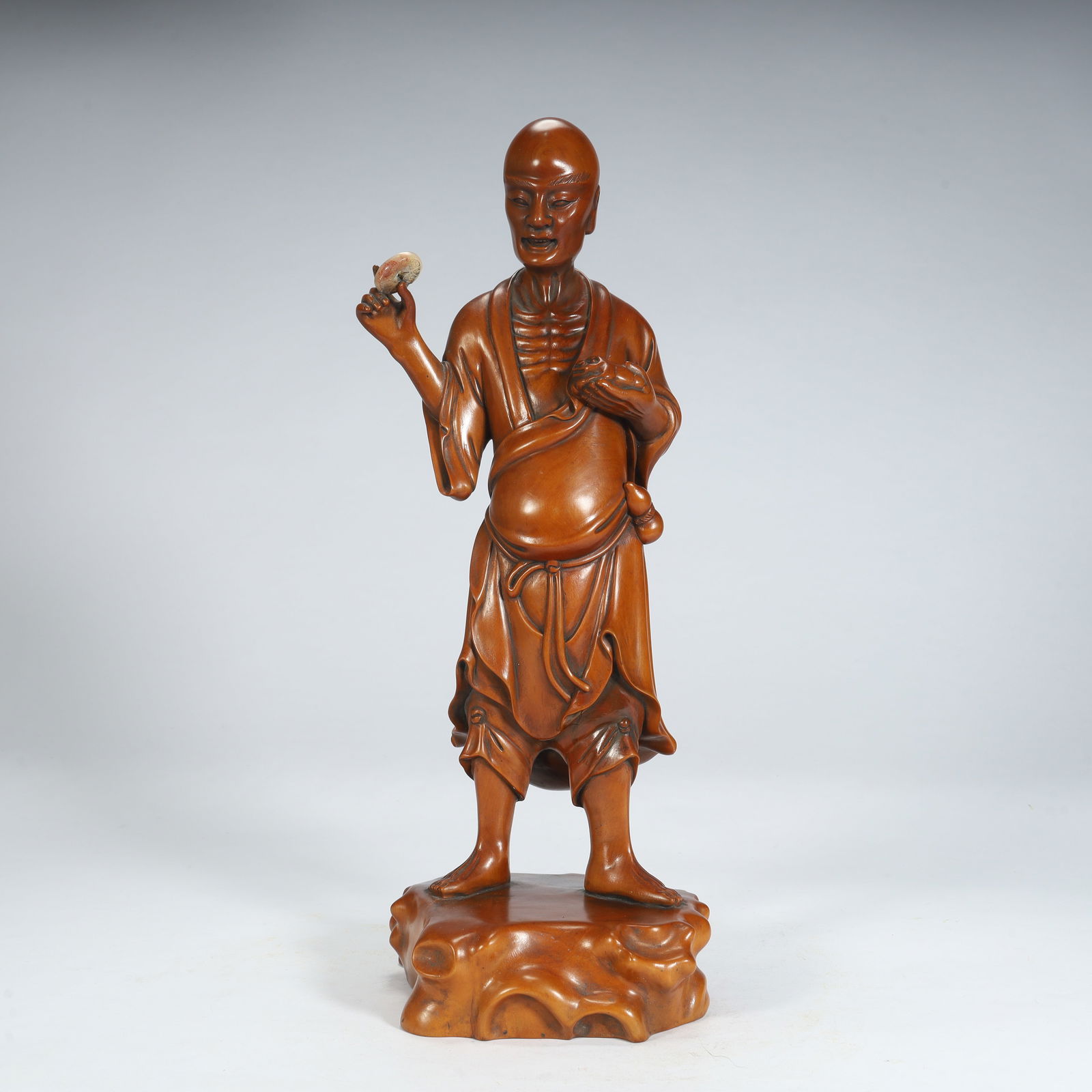 A Qing Dynasty boxwood carving statue holding Zhi Luohan: Qing Dynasty boxwood carving holding Zhi Luohan standing statue SIZE: H:36cm L:15cm W:13cm W:1044g (The Dimensions Of All Batches Are Manually Measured.If You Need More Detailed Information, Please
