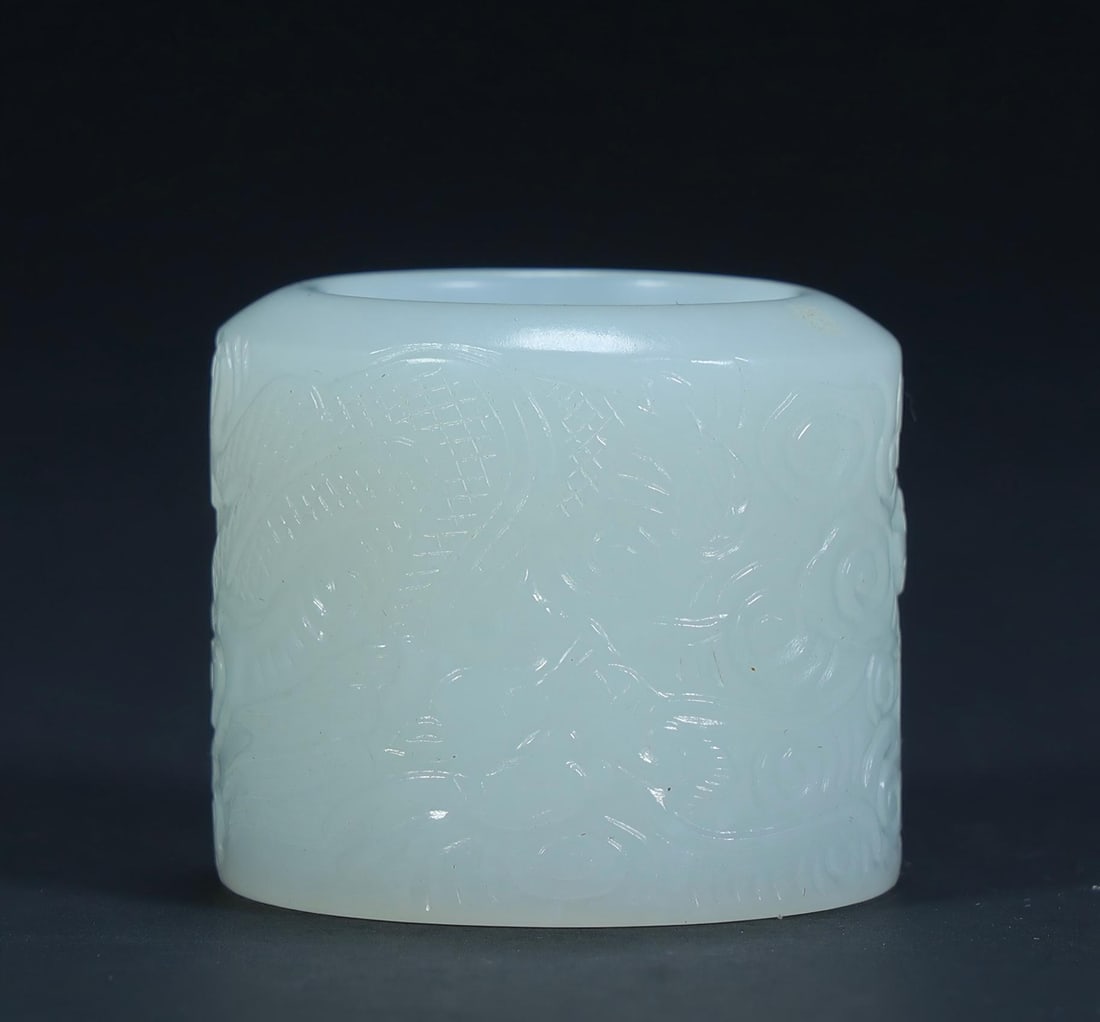 A Qing Dynasty Hetian jade bas-relief pattern finger: Qing Dynasty Hetian jade bas-relief pattern finger SIZE: H:3cm L:3cm W:3cm W:33.4g (The Dimensions Of All Batches Are Manually Measured.If You Need More Detailed Information, Please Contact Our Custom
