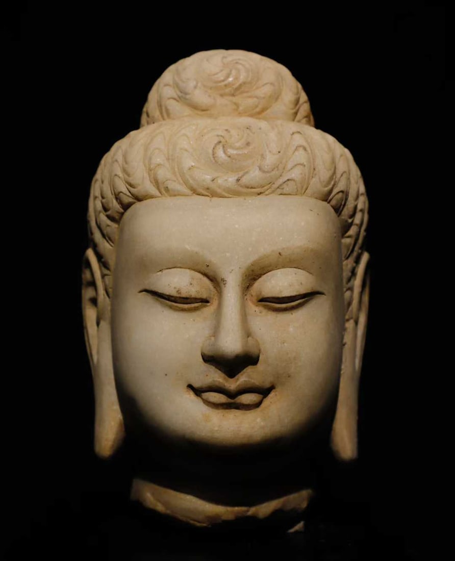 A white jade Buddha head of the Tang Dynasty (1 of 9)