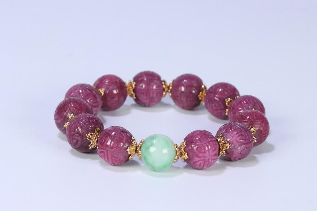 A late Qing Dynasty jade ruby group longevity pattern bracelet: Late Qing Dynasty jade ruby group longevity pattern bracelet SIZE: 1.3cm W:60g (The Dimensions Of All Batches Are Manually Measured.If You Need More Detailed Information, Please Contact Our Customer S