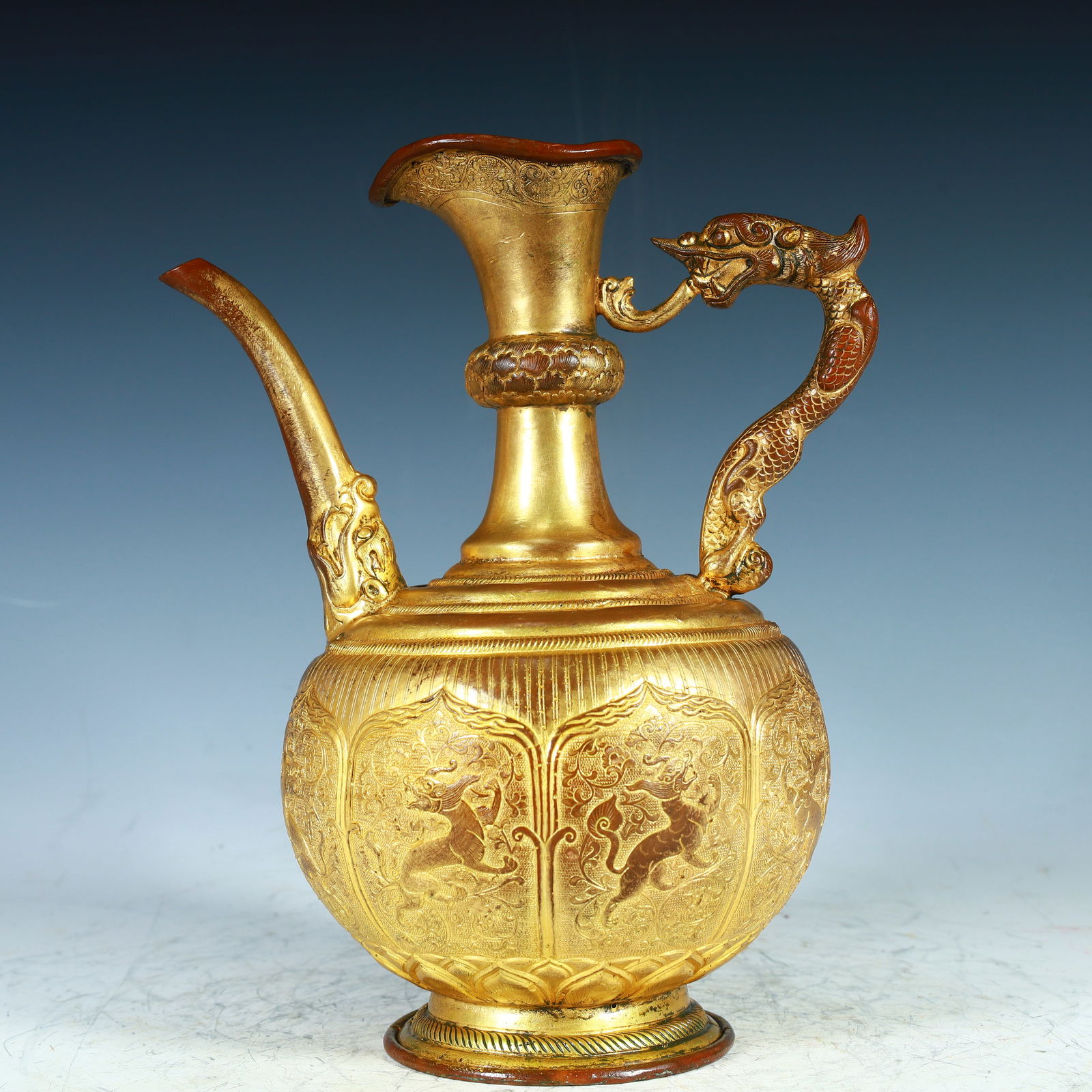A Qing Dynasty copper-gilt dragon pattern wine jug (1 of 10)
