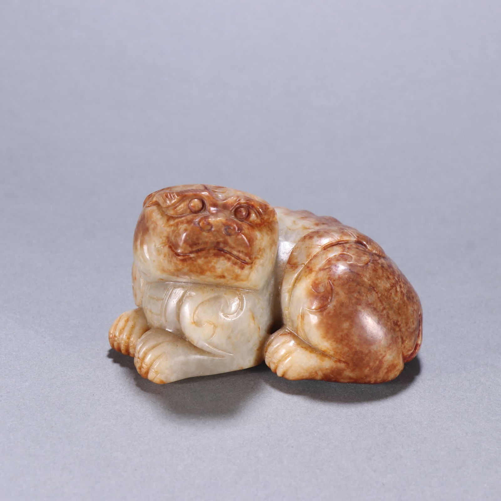 A Qing Dynasty Hetian jade beast ornament (1 of 9)