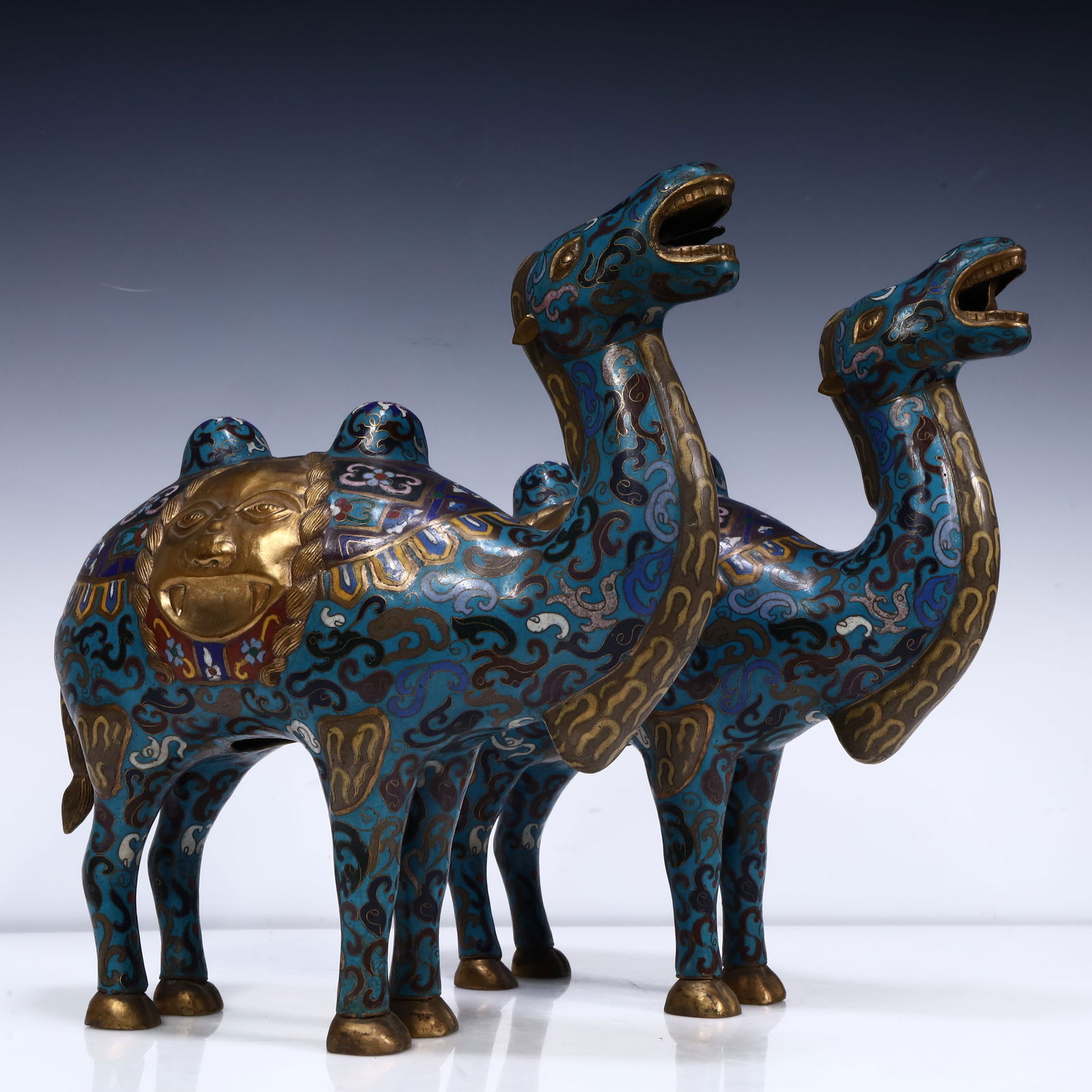 A pair of cloisonné camels: cloisonné camel SIZE: L:30cm W:8cm H:33cm W:2.7kg (The Dimensions Of All Batches Are Manually Measured.If You Need More Detailed Information, Please Contact Our Customer Service Before Bidding.)