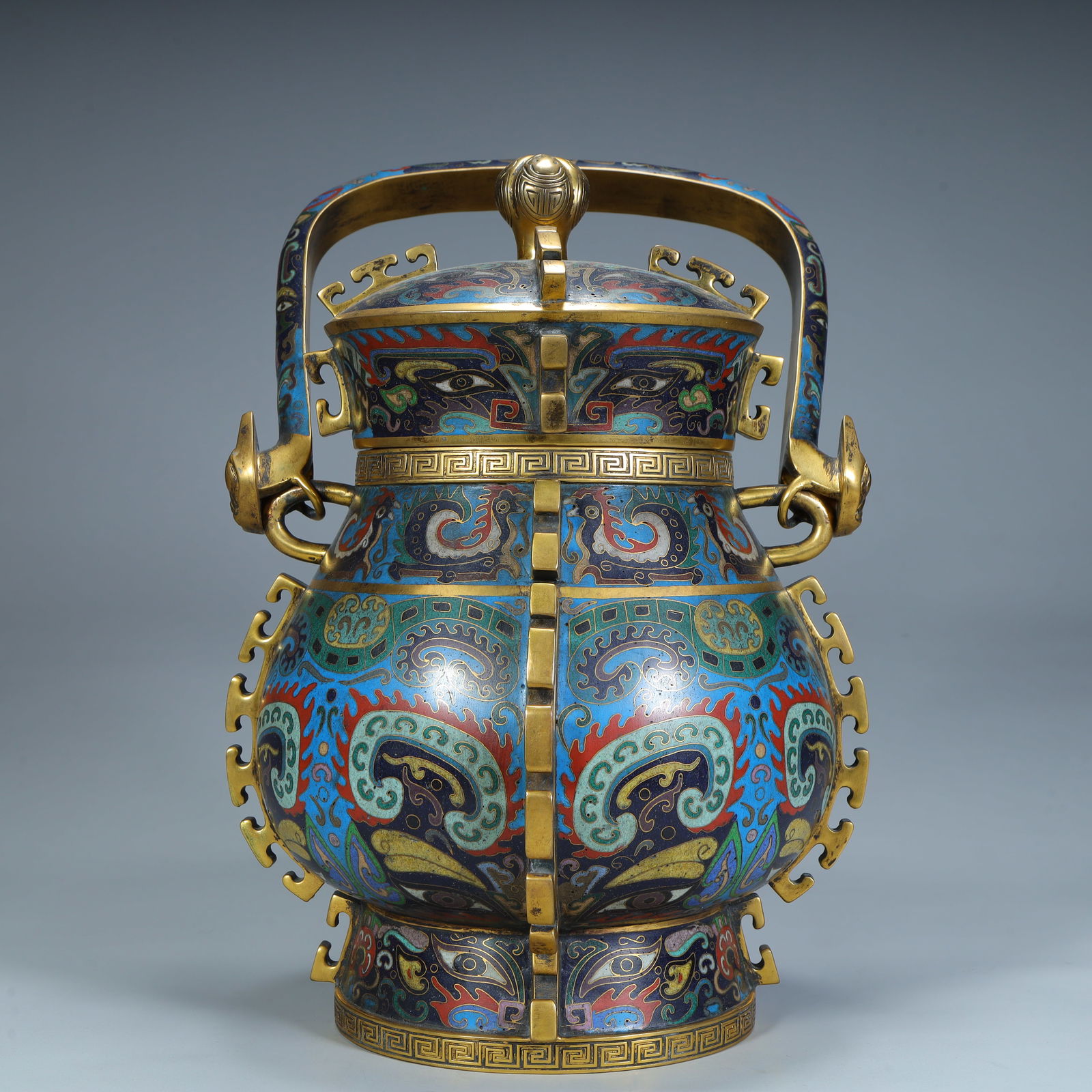 A Qing Dynasty copper tire cloisonné enamel animal face pattern Tiliang tripod: Qing Dynasty copper tire cloisonné enamel animal face pattern lift beam SIZE: H:35cm L:22cm W:19cm W:3.8kg (The Dimensions Of All Batches Are Manually Measured.If You Need More Detailed Information,