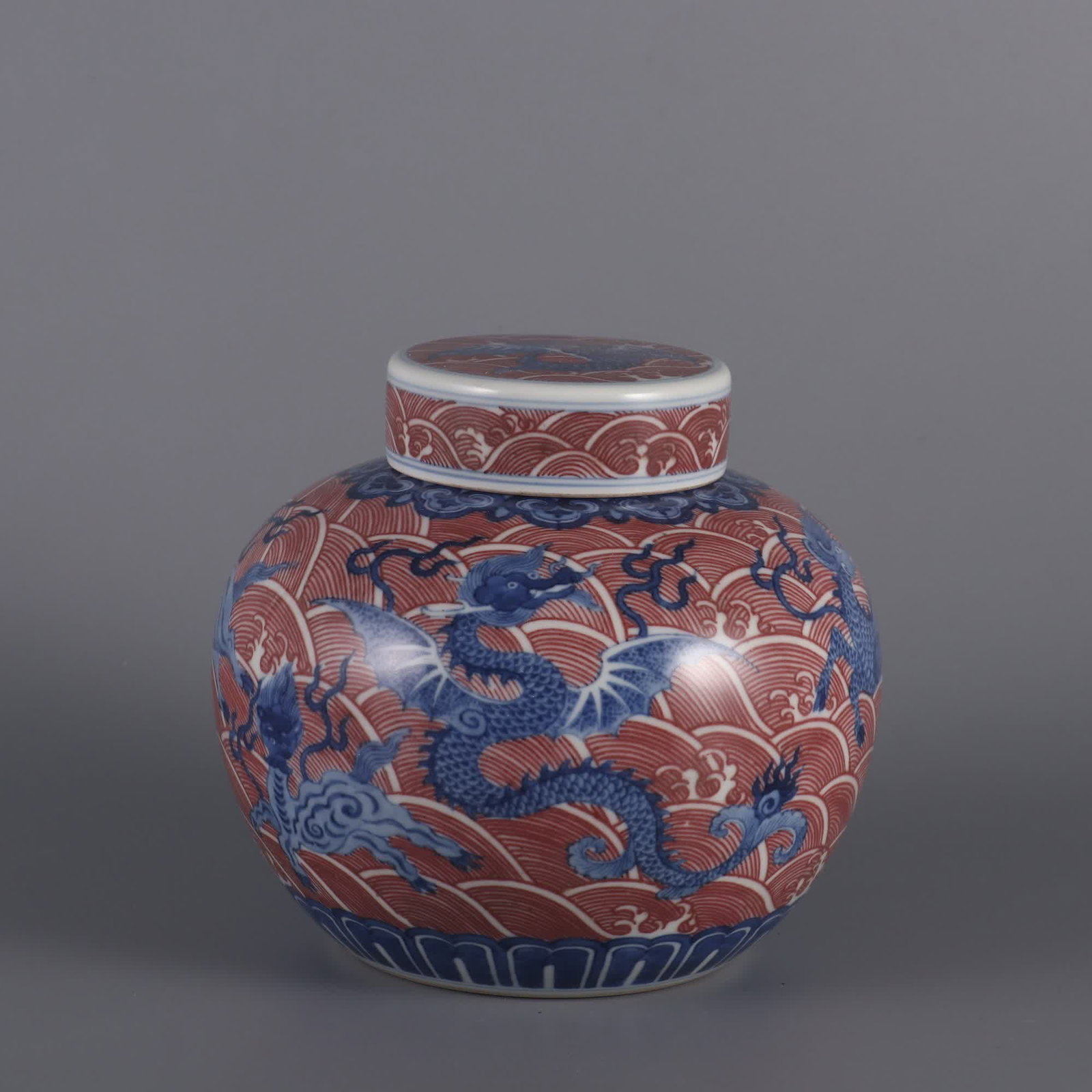 A blue and white glazed red sea sea monster pattern heavenly jar made in the Qing Yongzheng era: Qing Yongzheng year blue and white glaze red sea sea monster pattern heavenly character jar SIZE: H: 12.8cm Belly diameter 13.5cm mouthD: 6cm (The Dimensions Of All Batches Are Manually Measured.If Yo