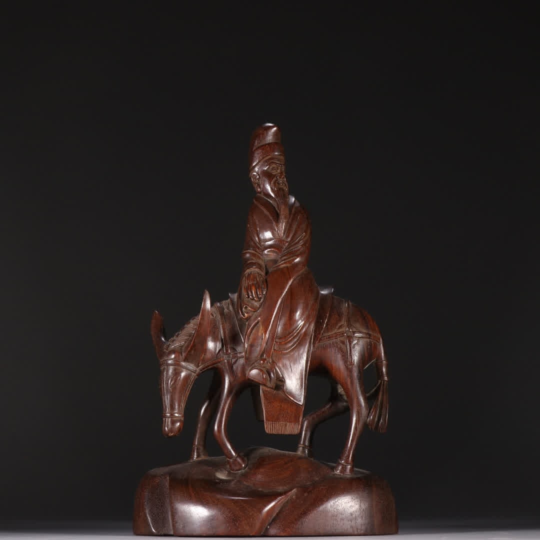 A Qing Dynasty rosewood carving Zhang Guo old donkey ornament: Qing Dynasty rosewood carving Zhang Guo old donkey riding ornament SIZE: H:22cm W:13.5cm W:459.8g (The Dimensions Of All Batches Are Manually Measured.If You Need More Detailed Information, Please Con