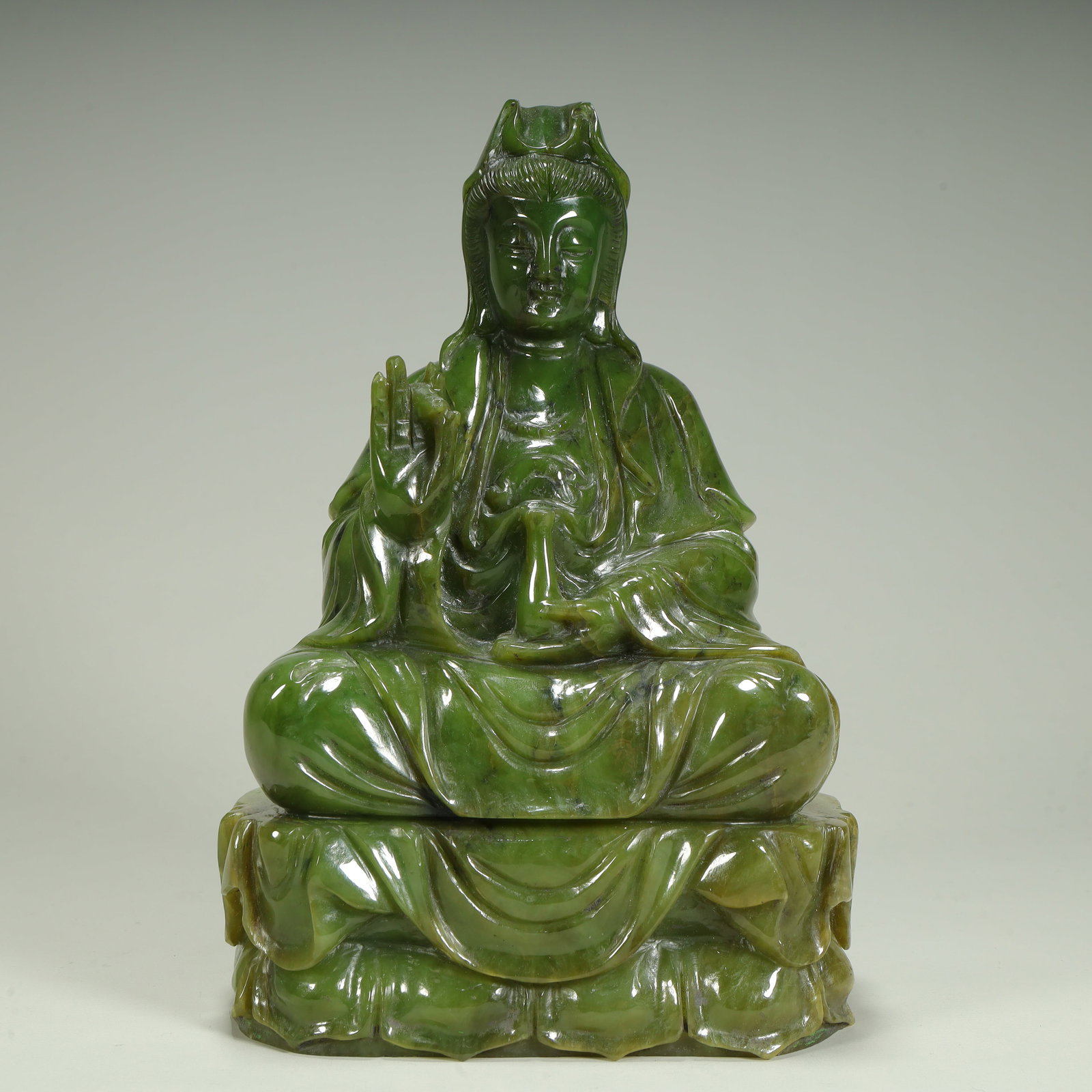 A seated statue of Guanyin in jasper: Jasper Guanyin seated statue SIZE: H:20cm L:13.5cm W:8cm W:2.8kg (The Dimensions Of All Batches Are Manually Measured.If You Need More Detailed Information, Please Contact Our Customer Service Before