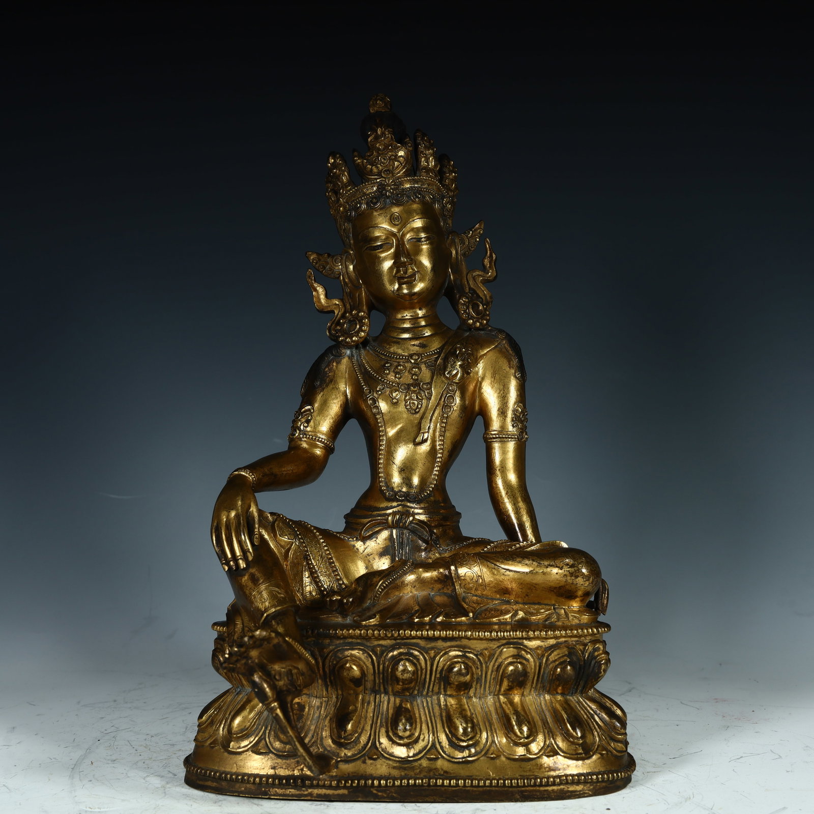 A Qing Dynasty bronze gilt green Tara statue: Qing Dynasty copper gilt green Tara statue SIZE: H:31.5cm L:19cm W:15cm W:4.6kg (The Dimensions Of All Batches Are Manually Measured.If You Need More Detailed Information, Please Contact Our Customer