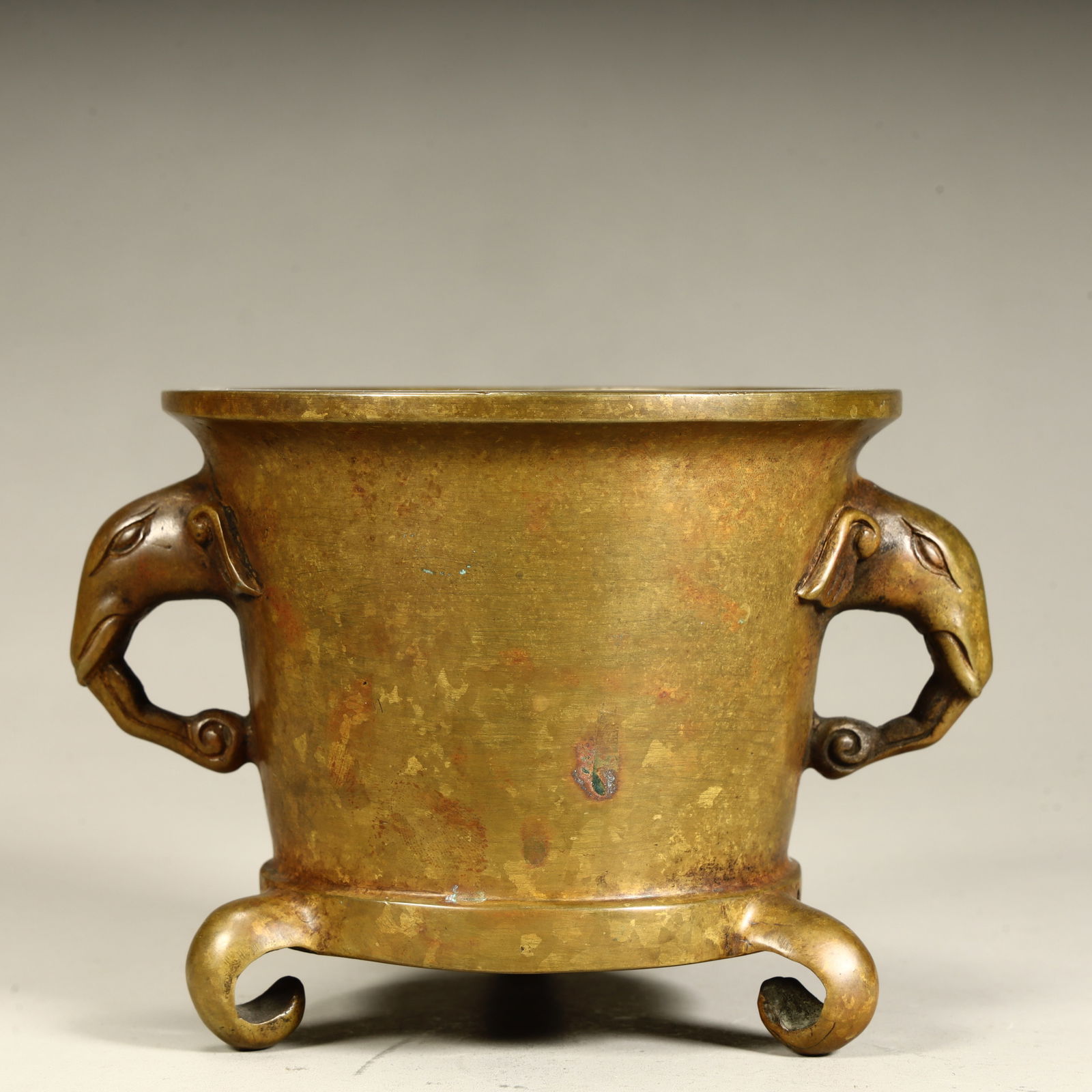 A Qing Dynasty fine elephant trunk ear three-legged incense burner: Qing Dynasty fine elephant trunk ear three-legged incense burner SIZE: H:9.5cm L:13cm W:11cm W:1091g (The Dimensions Of All Batches Are Manually Measured.If You Need More Detailed Information, Please