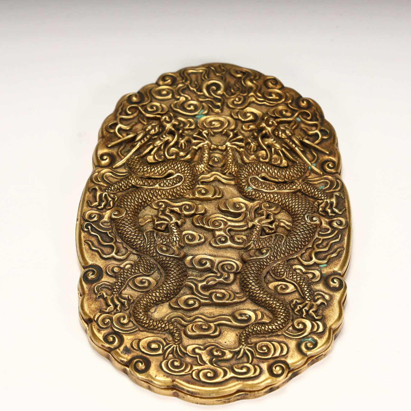 A piece of copper gilded, embossed with double dragon bead pattern on the surface of the box,: Copper gilded, embossed double dragon bead pattern on the box surface, surrounded by cloud patterns, strong three-dimensional decoration, exquisite craftsmanship, is a furnishing or practical box with