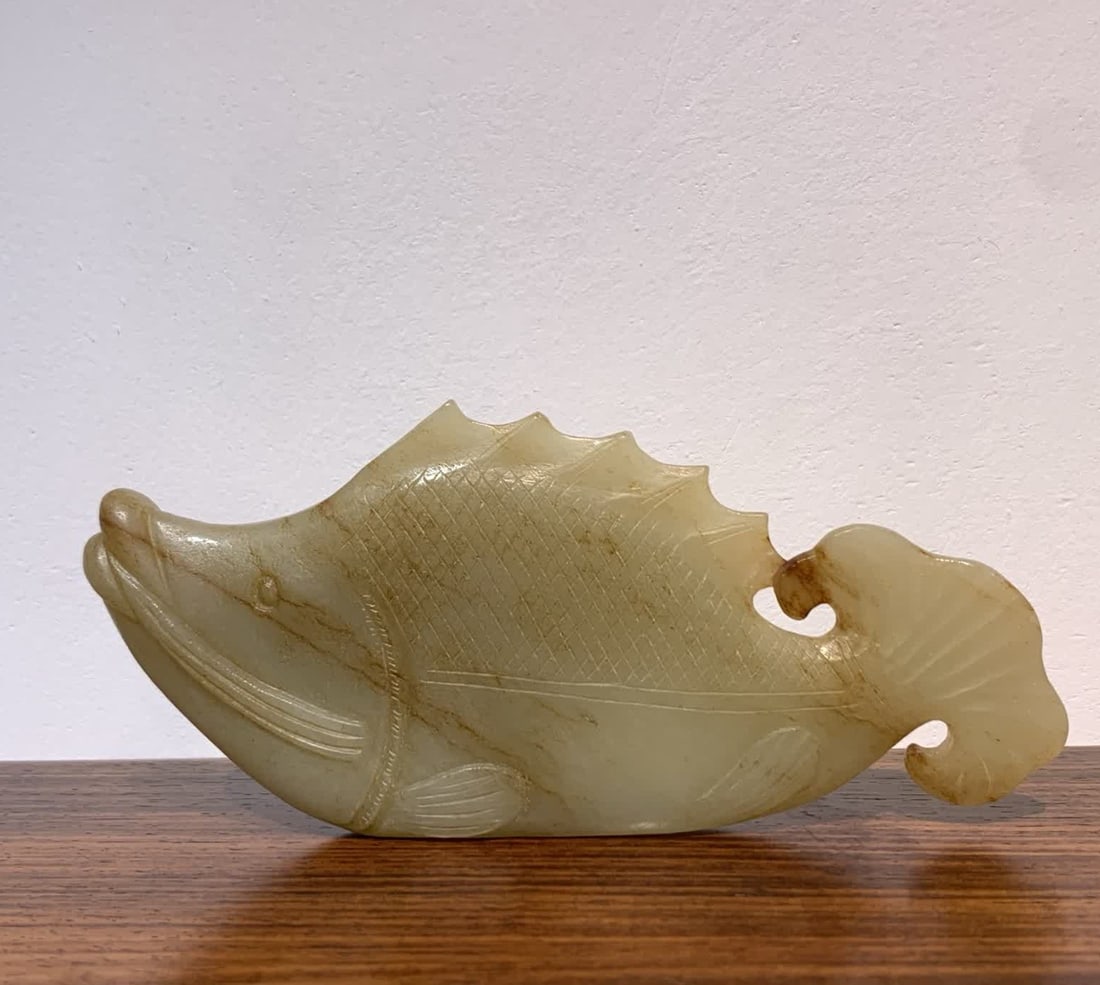 A Ming Dynasty Hetian white jade osmanthus fish: Ming Dynasty Hetian white jade osmanthus fish SIZE: L:13.3W:5.6T:1.5W:143g (The Dimensions Of All Batches Are Manually Measured.If You Need More Detailed Information, Please Contact Our Customer Servi