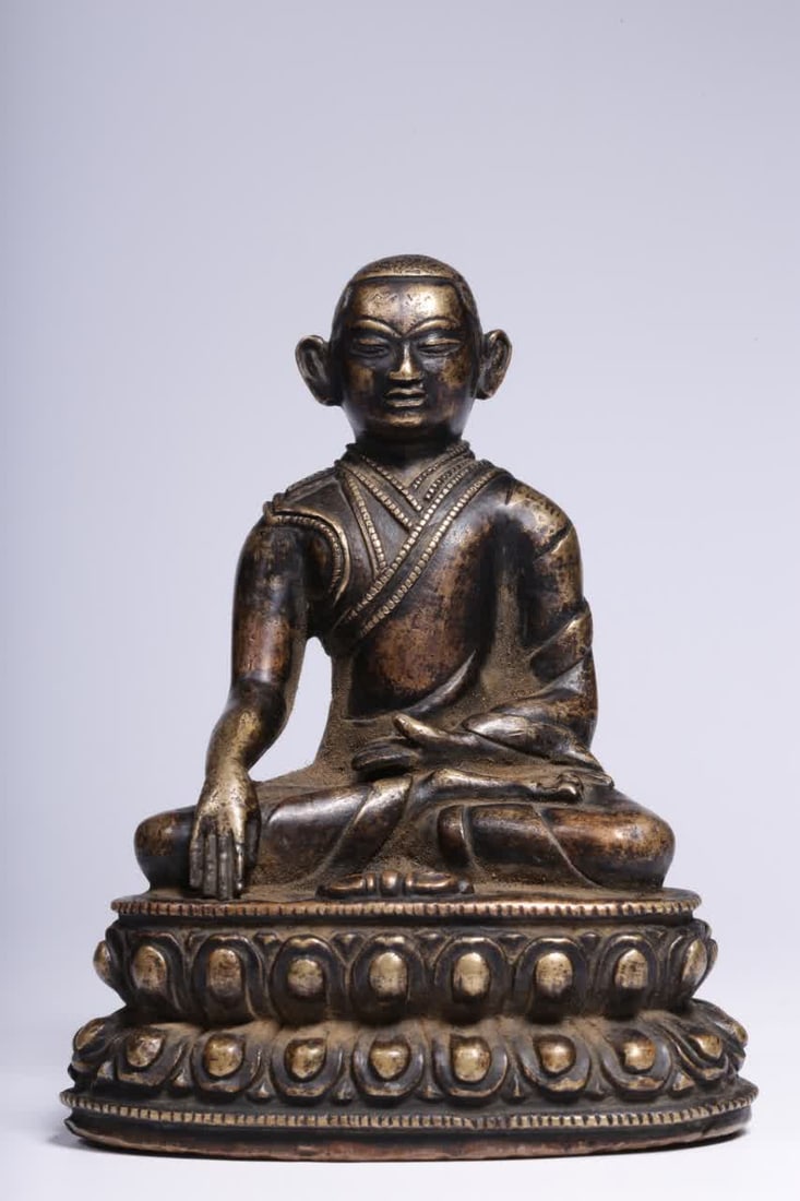 A Qing Dynasty alloy copper Marpa statue: Qing Dynasty box gold and bronze Marpa statue SIZE: H:10.2cm L:5.5cm W:8cm W:430g (The Dimensions Of All Batches Are Manually Measured.If You Need More Detailed Information, Please Contact Our Custome