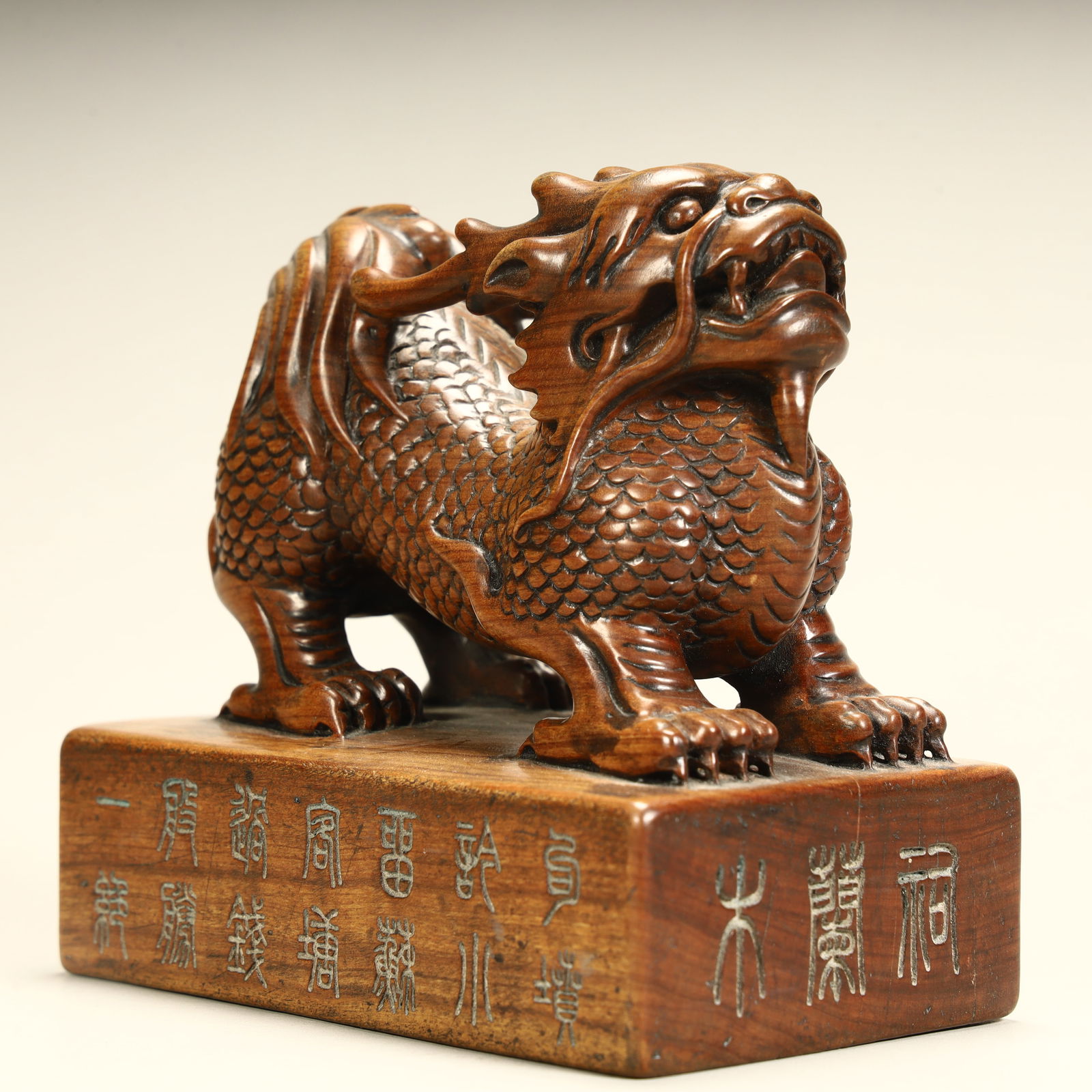 A Qing Dynasty boxwood carved unicorn button seal: Qing Dynasty boxwood carving unicorn button seal SIZE: H:10cm L:10.5cm W:6.5cm W:363g (The Dimensions Of All Batches Are Manually Measured.If You Need More Detailed Information, Please Contact Our Cus