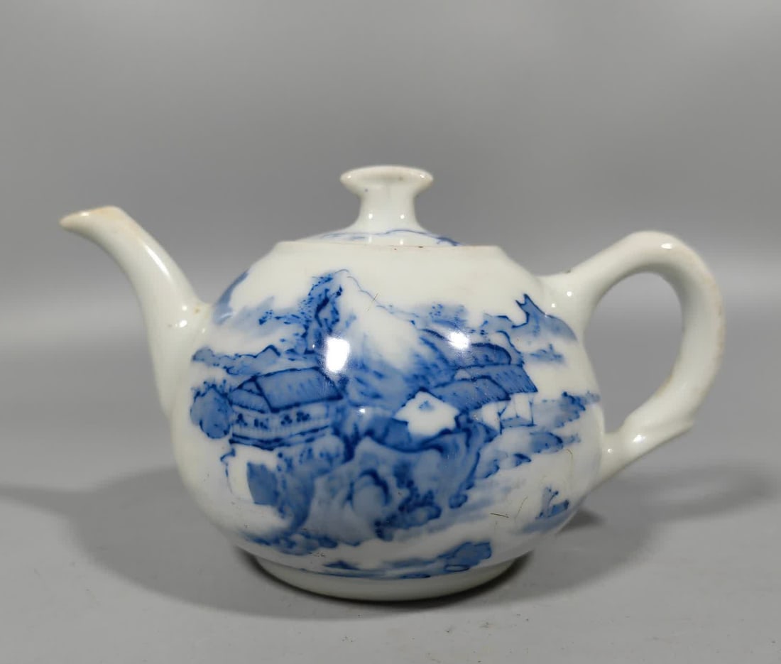 A Qing Dynasty blue and white landscape kettle: Qing Dynasty blue and white mountain kettle SIZE: L:15cm W:10.5cm H:9.2cm (The Dimensions Of All Batches Are Manually Measured.If You Need More Detailed Information, Please Contact Our Customer Servic