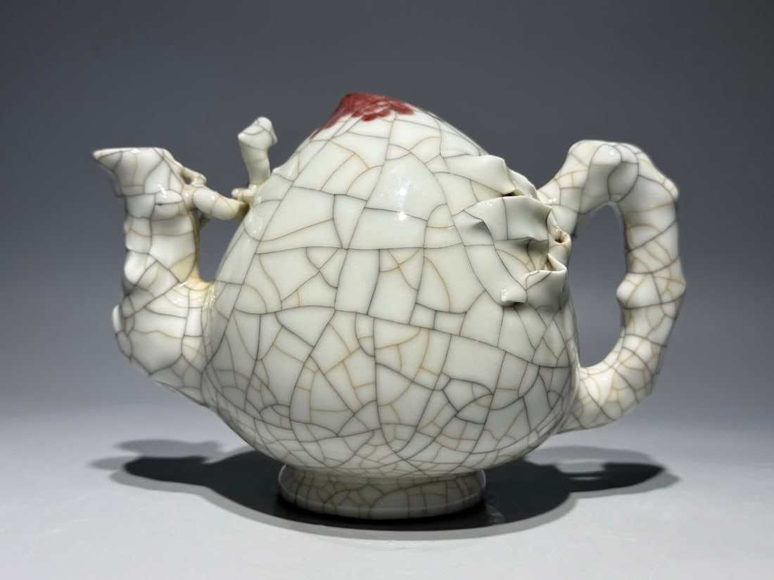 A Qianlong year official glazed peach-shaped inverted flow pot (1 of 9)