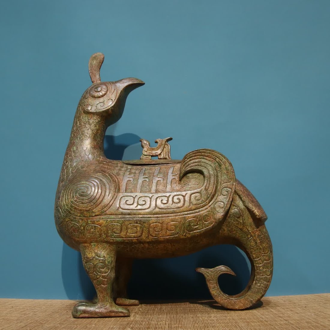 A bronze bird statue - 3