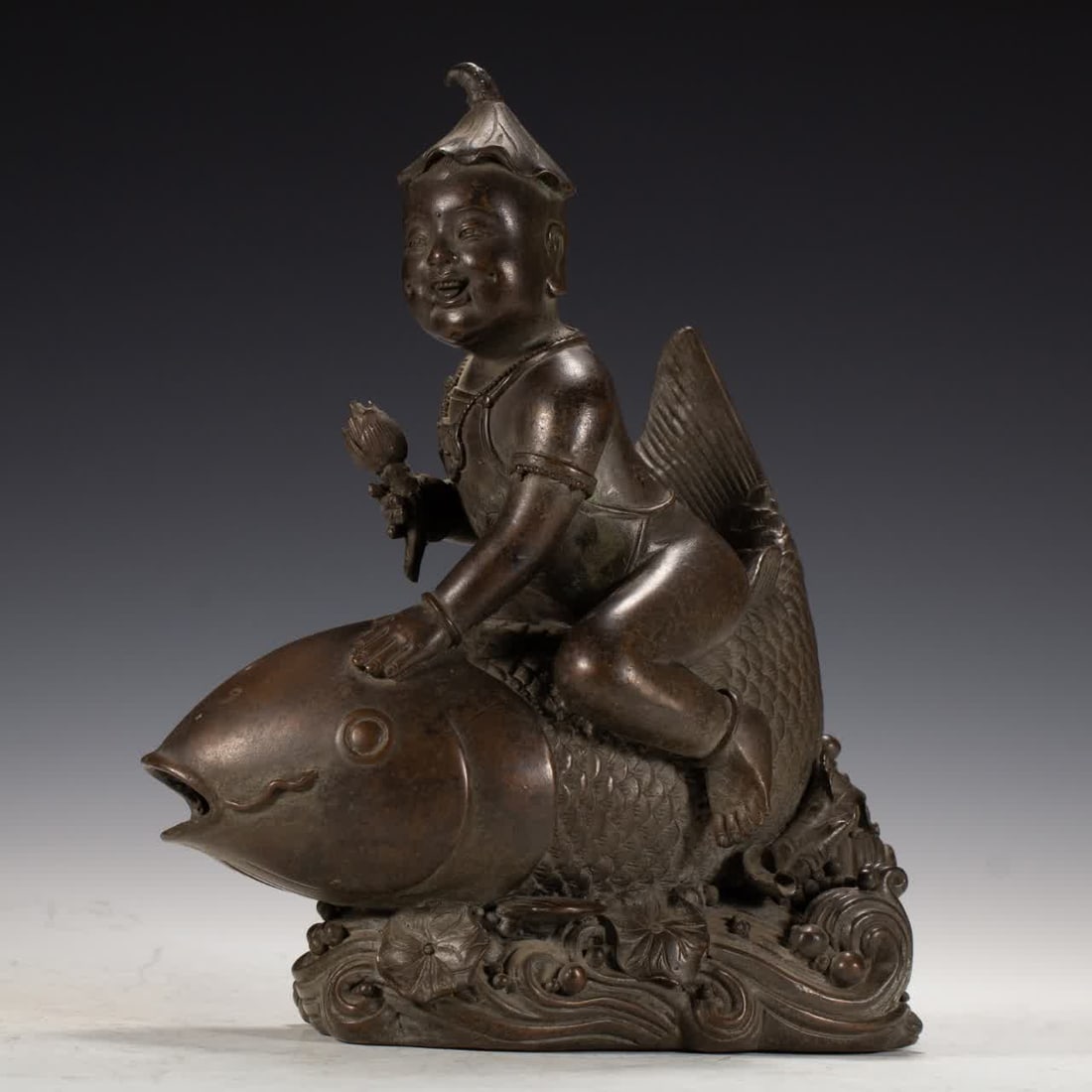 A copper fish-riding boy from the Qing Dynasty: The copper fish boy of the Qing Dynasty SIZE: L:20cm W:13cm H:23cm (The Dimensions Of All Batches Are Manually Measured.If You Need More Detailed Information, Please Contact Our Customer Service