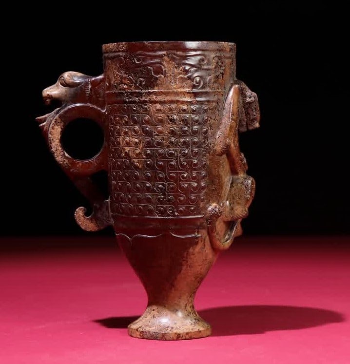 A Han Dynasty dragon cup: Han Dynasty dragon cup SIZE: 125x93x56mm W:274g (The Dimensions Of All Batches Are Manually Measured.If You Need More Detailed Information, Please Contact Our Customer Service Before Bidding.)