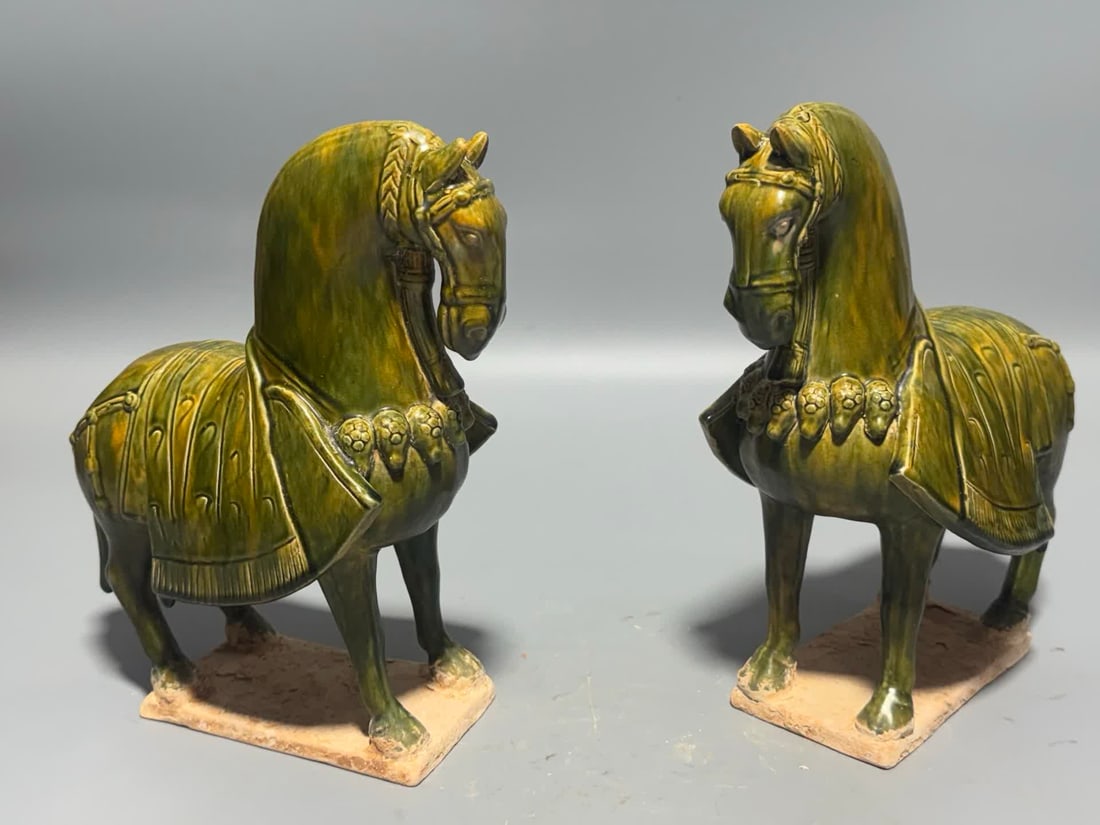 A pair of Tang Sancai green glazed horses: Tang Sancai green glazed horse SIZE: H:26cm W:20cm (The Dimensions Of All Batches Are Manually Measured.If You Need More Detailed Information, Please Contact Our Customer Service Before Bidding.)