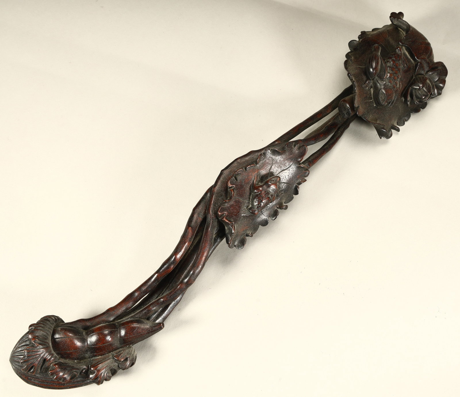 A Qing Dynasty rosewood carved lotus with a noble child pattern (1 of 12)