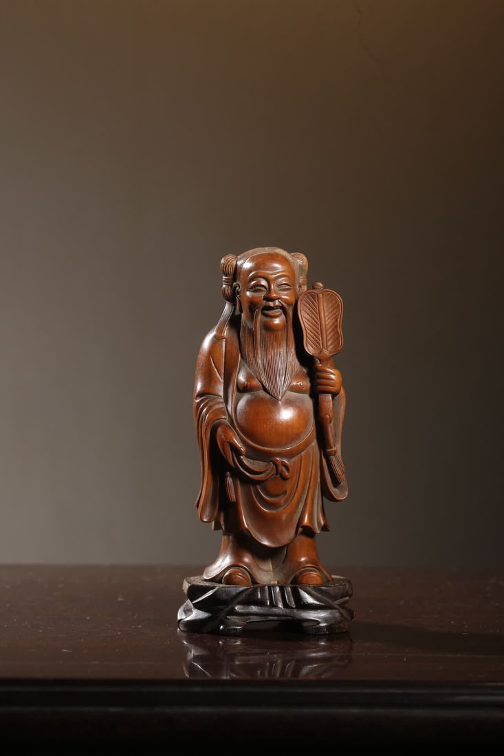 A piece of Qing Dynasty boxwood carving Han Zhongli ornament (original mahogany base): Qing Dynasty boxwood carving Han Zhongli ornament (original mahogany base) SIZE: Total H: 17.5cm Boxwood H: 14.5cm (The Dimensions Of All Batches Are Manually Measured.If You Need More Detailed Inform