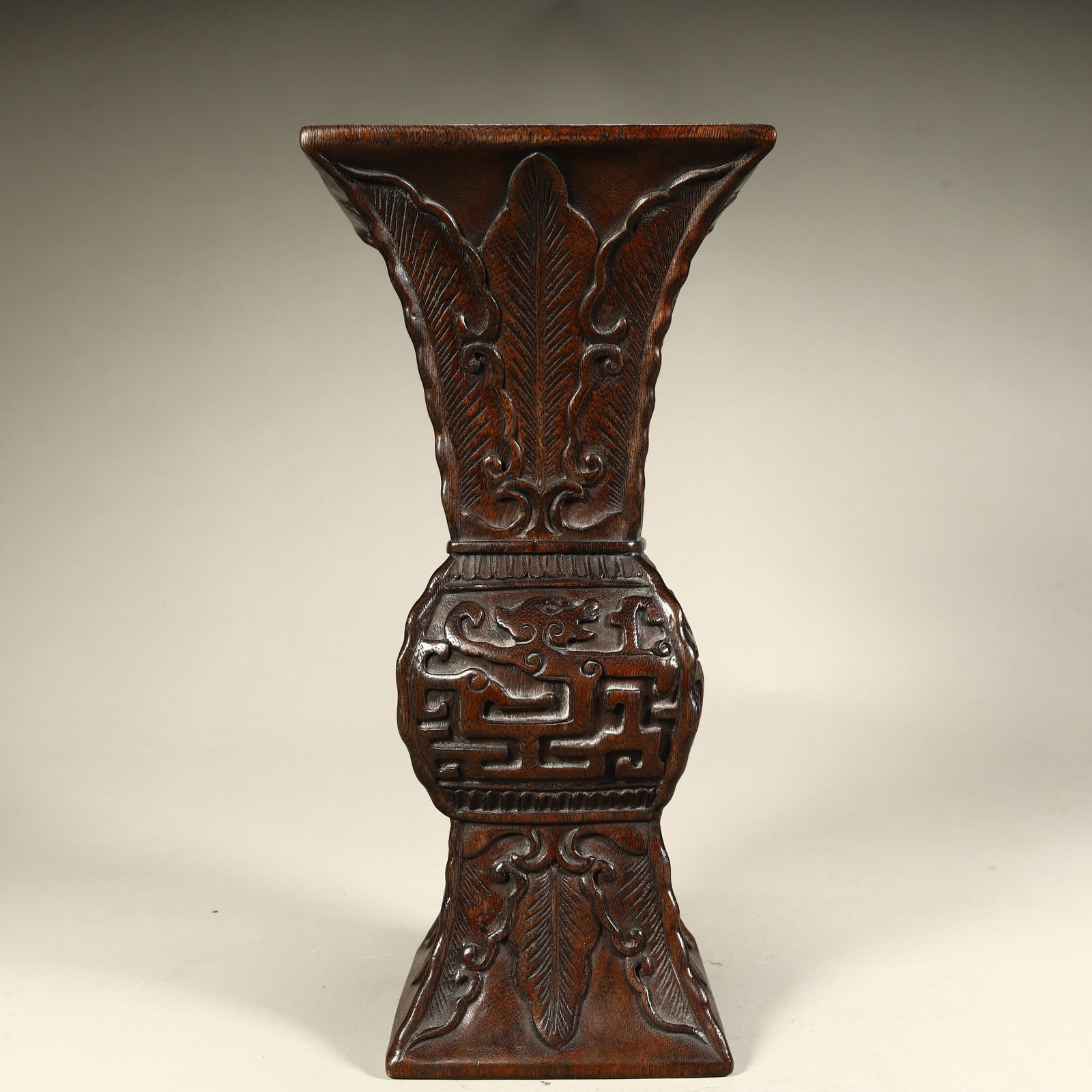 A Qing Dynasty agarwood carved banana leaf Kui dragon pattern square cup: Qing Dynasty agarwood carved banana leaf Kui dragon pattern square cup SIZE: SIZE: H:27cm L:13cm W:13cm W:487.8g (The Dimensions Of All Batches Are Manually Measured.If You Need More Detailed Informat
