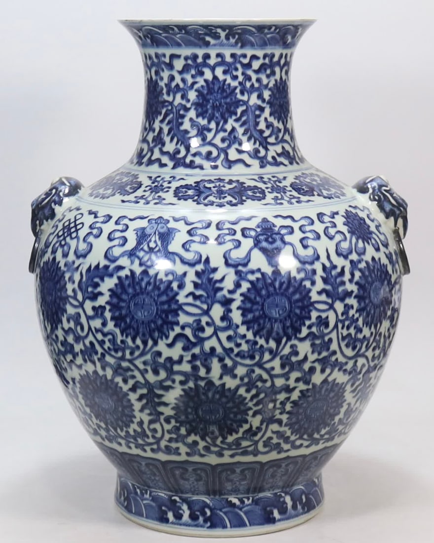 A blue and white entwined eight-treasure pattern beast ear made in the Qianlong period of the Qing: Qing Qianlong year blue and white entwined eight treasure pattern beast ears SIZE: H:53.5cm mouthD:21cm (The Dimensions Of All Batches Are Manually Measured.If You Need More Detailed Information, Plea