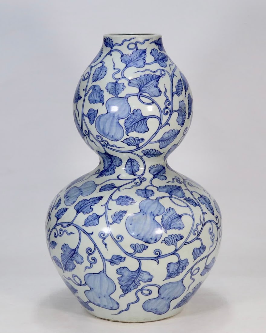 A Yuan blue and white entwined Fulu Bandai large gourd bottle: Yuan blue and white entwined branch Fu Lu Bandai large gourd bottle SIZE: H:46cm (The Dimensions Of All Batches Are Manually Measured.If You Need More Detailed Information, Please Contact Our