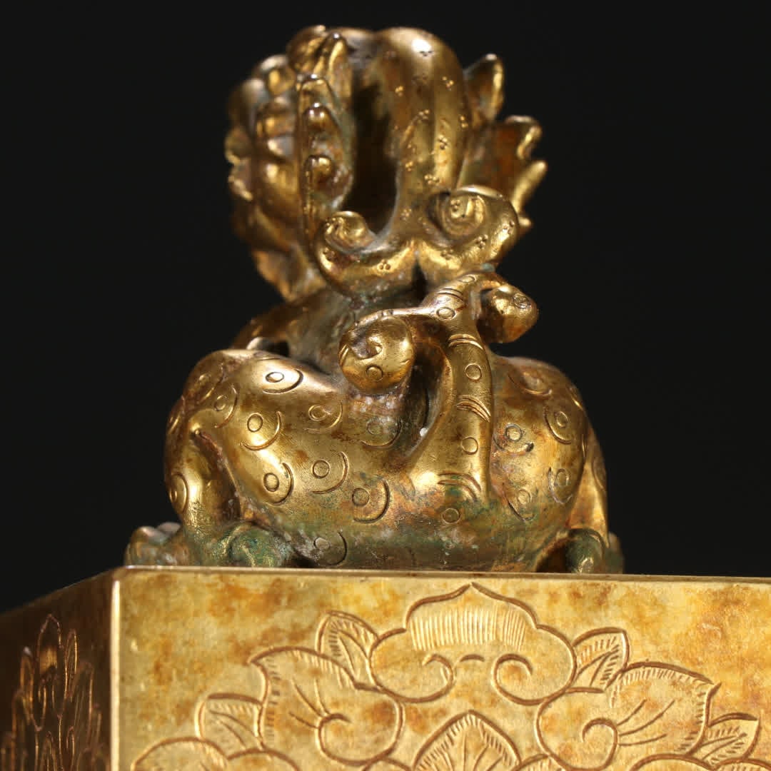 A copper gilt beast button seal - 4