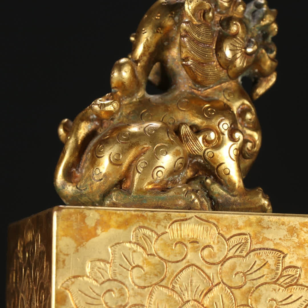 A copper gilt beast button seal - 6
