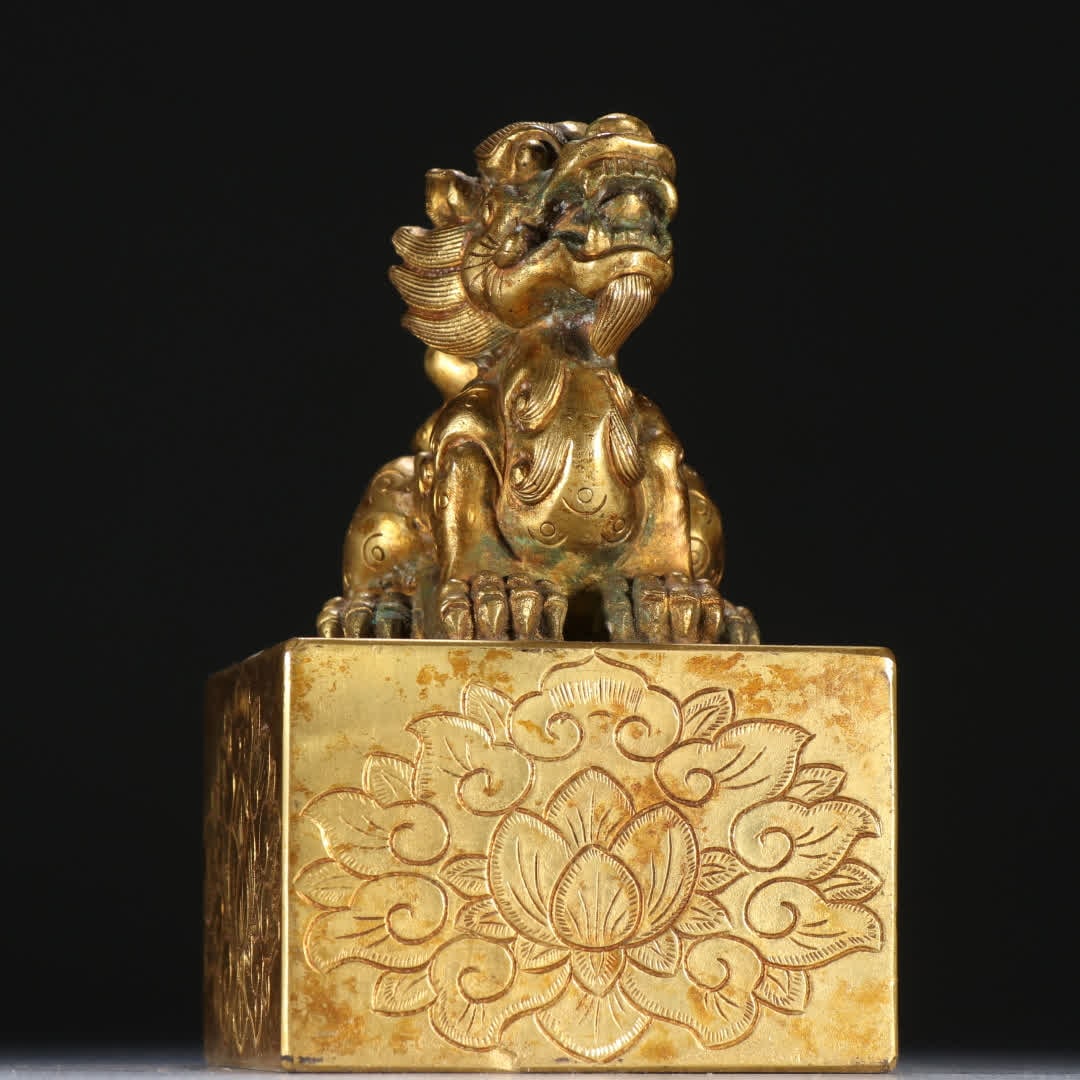 A copper gilt beast button seal - 7