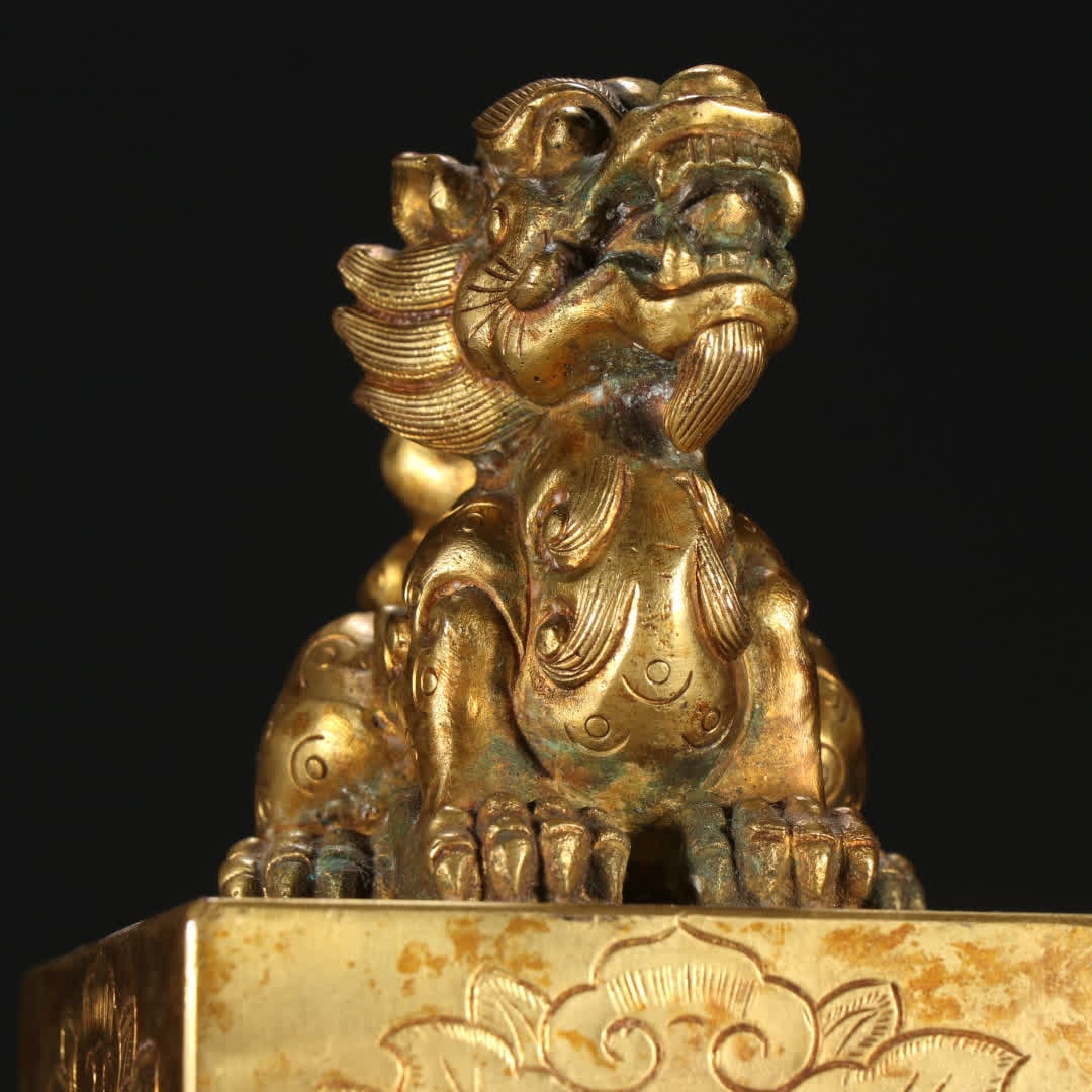A copper gilt beast button seal - 8
