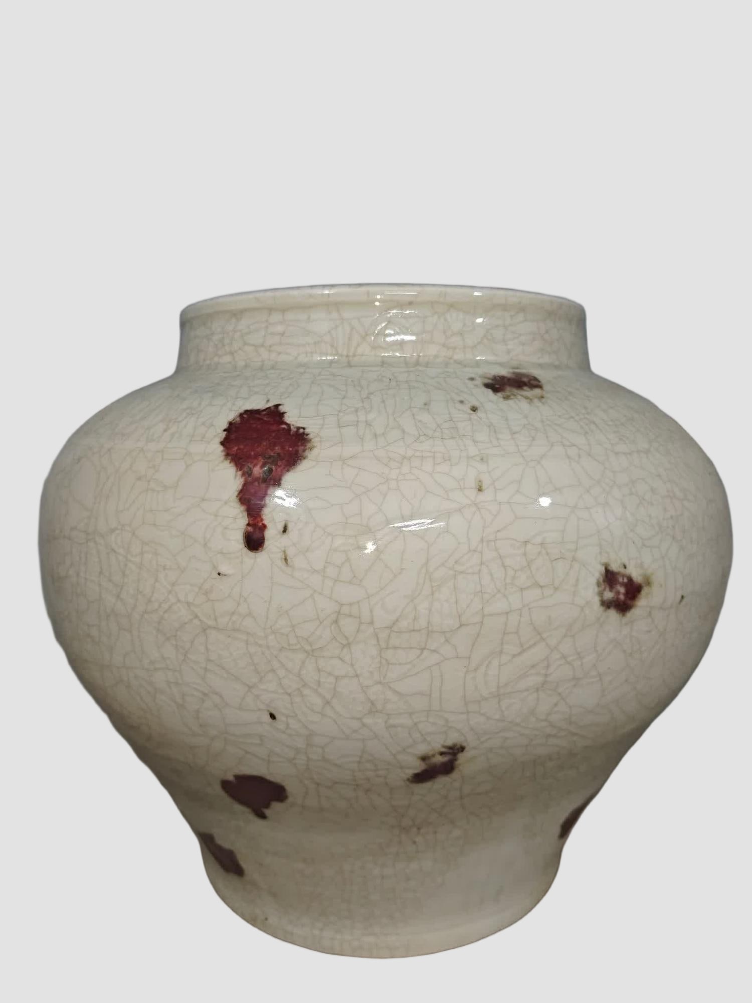 A glazed red brindle jar - 2