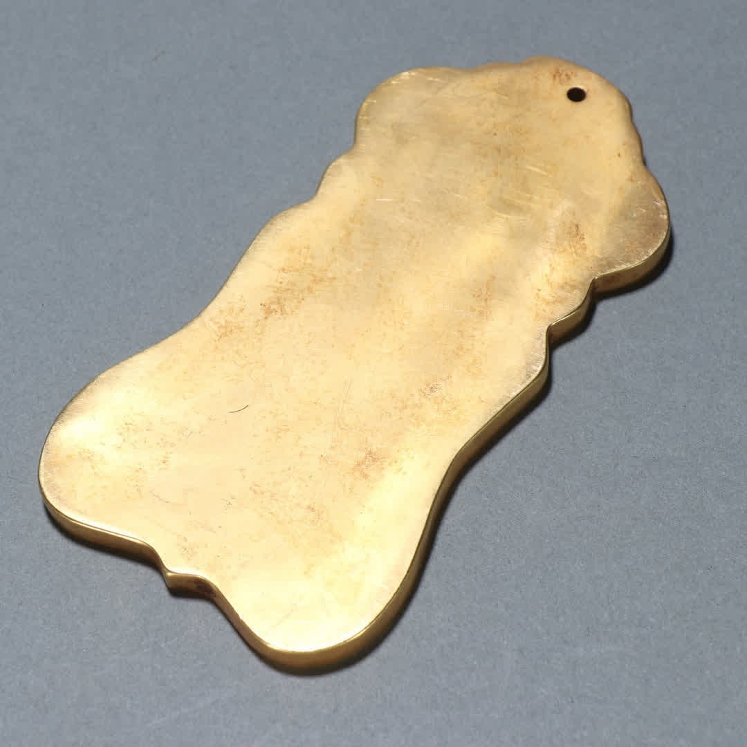 A copper-gilt token - 7
