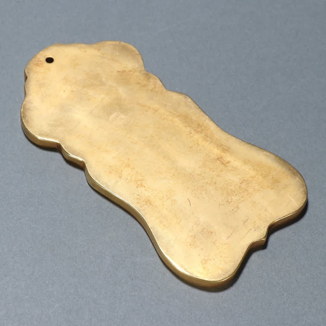 A copper-gilt token - 8