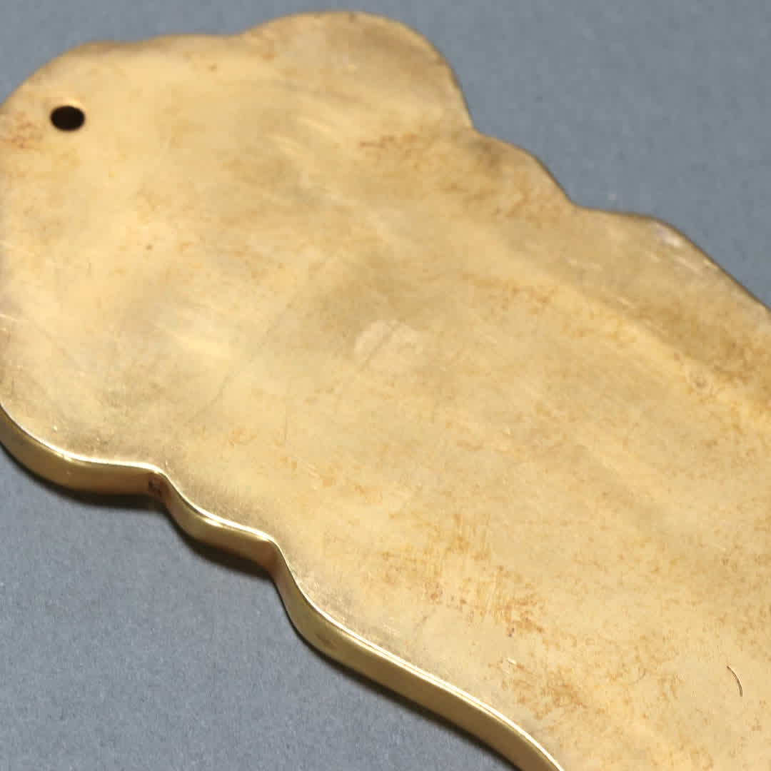 A copper-gilt token - 9